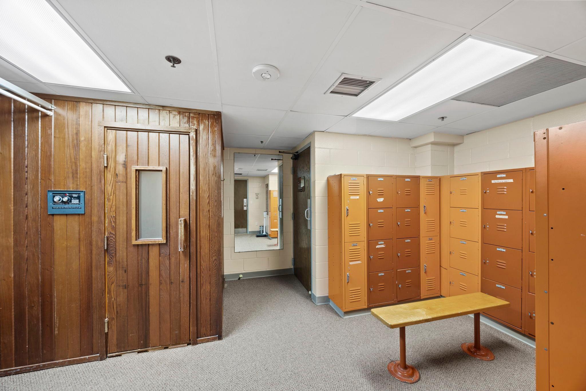 Locker rooms featuring showers and a sauna for a spa-like experience.