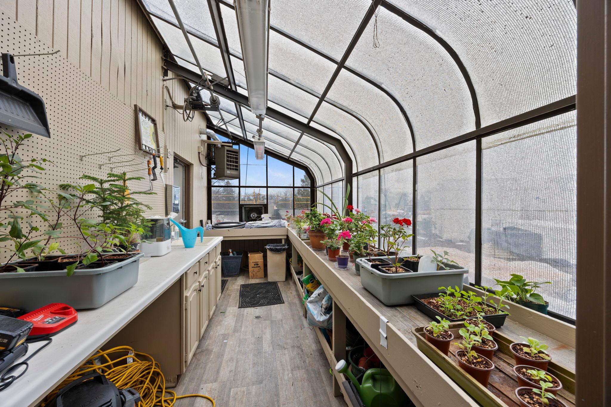 Additional highlights include an upper-level greenhouse.