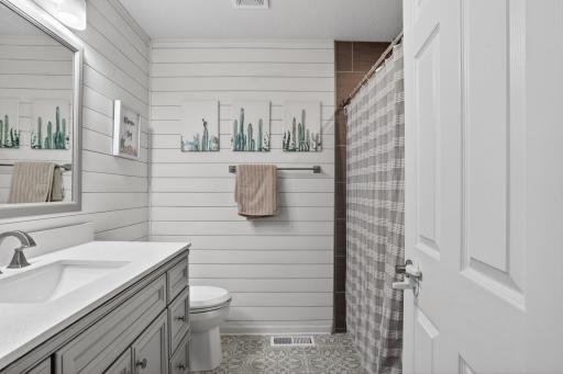 Upper level bath has really cute, high quality updates