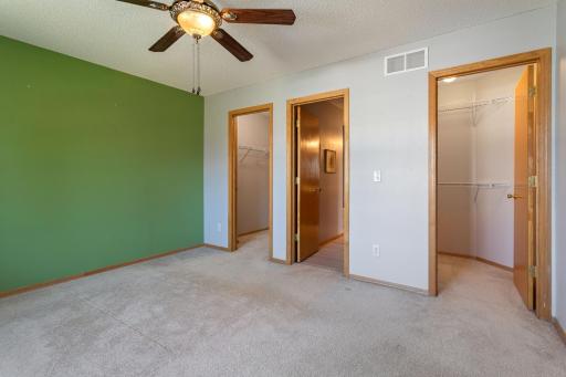 07 Upper level bedroom with walkthru primary bath.jpg