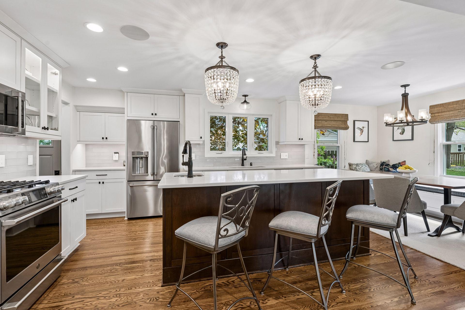 A place for everything, with luxurious tile backsplash, spacious countertops and a prep sink on the center island.