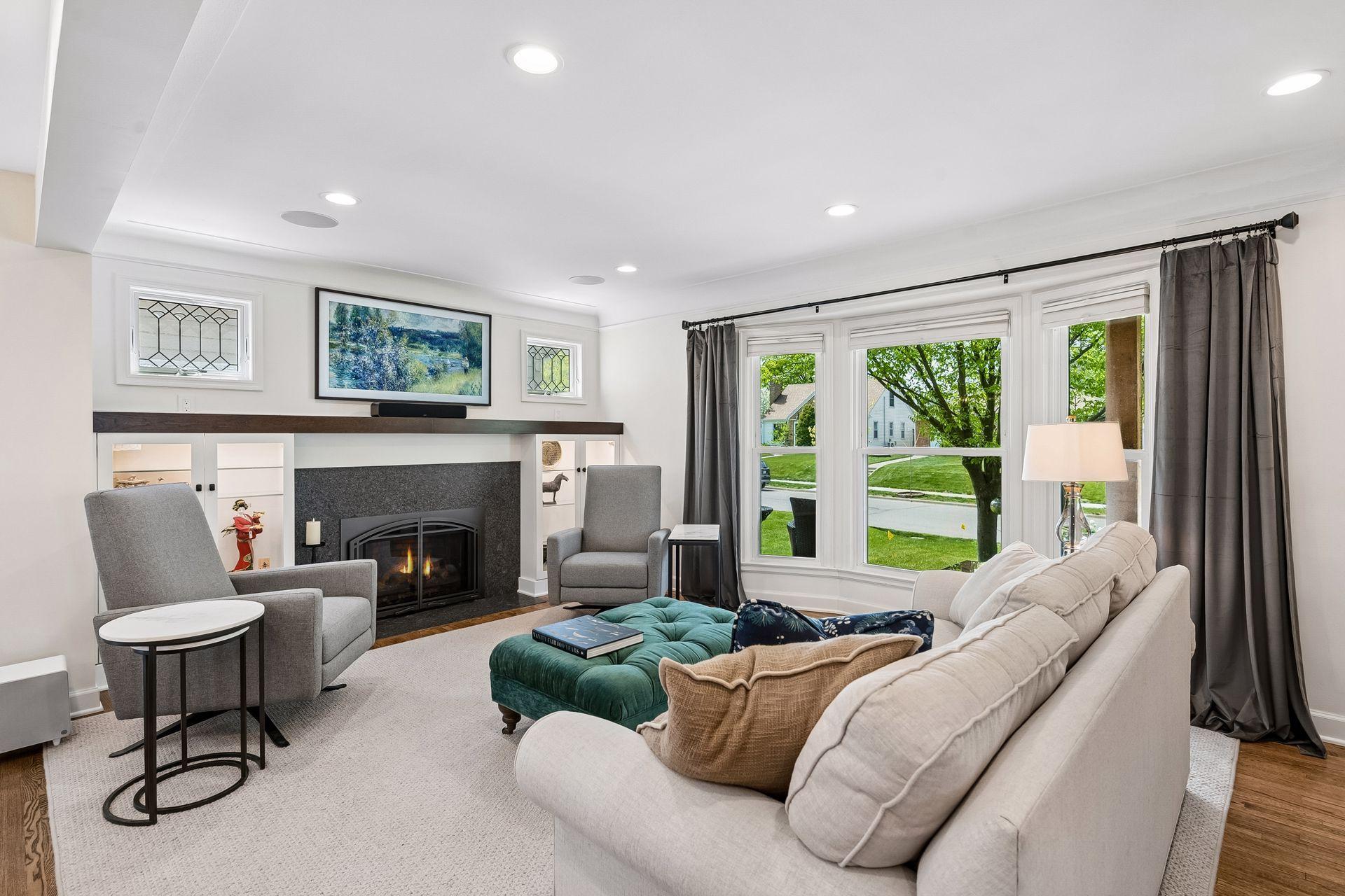 Front living room area overlooks quiet Newton Avenue, with built-ins and mantel surrounding the updated fireplace area.