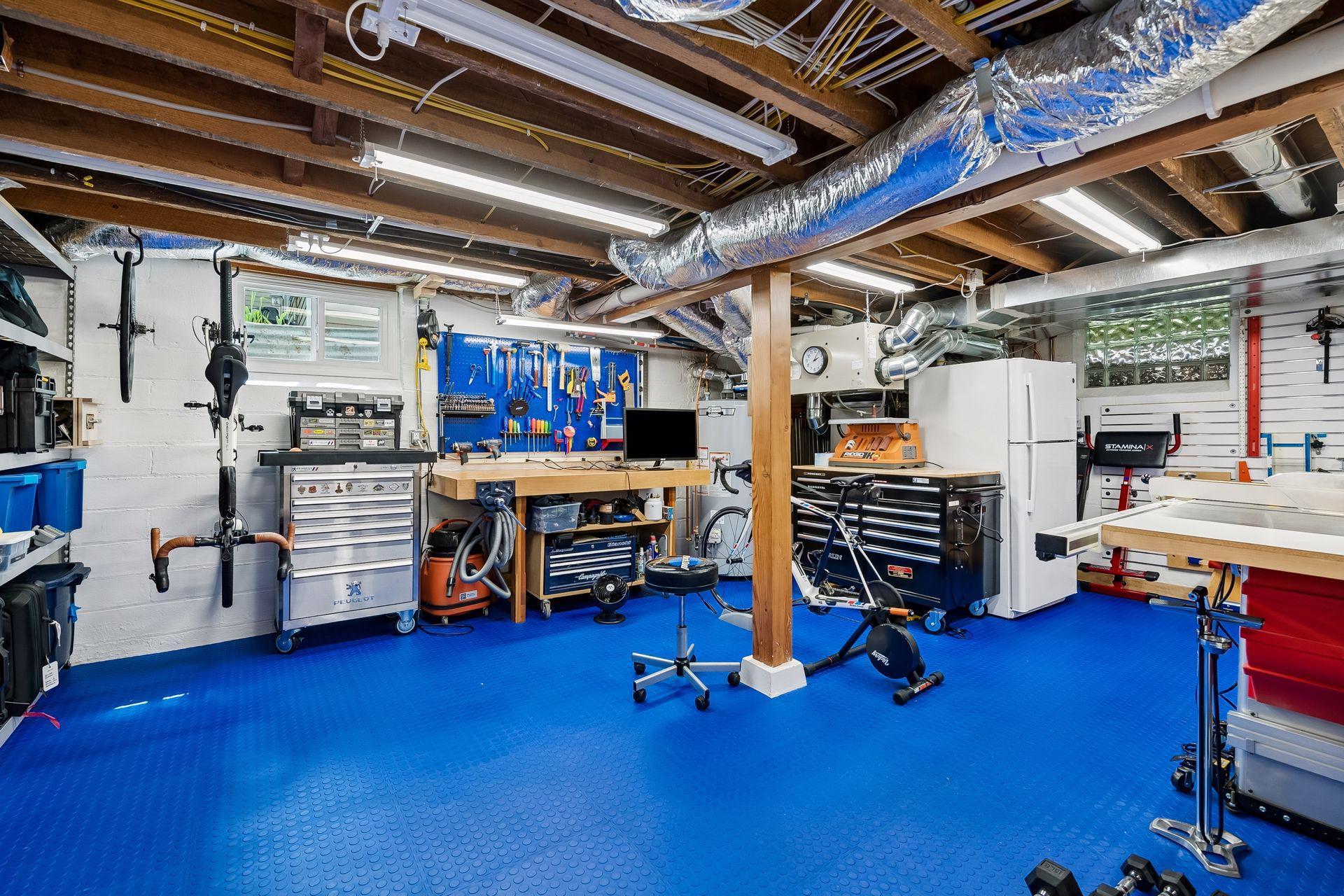 Large workshop room is perfect for tinkering, building, or could be used as an exercise space or play area.