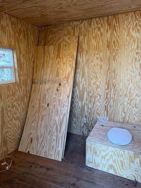 Heated outhouse