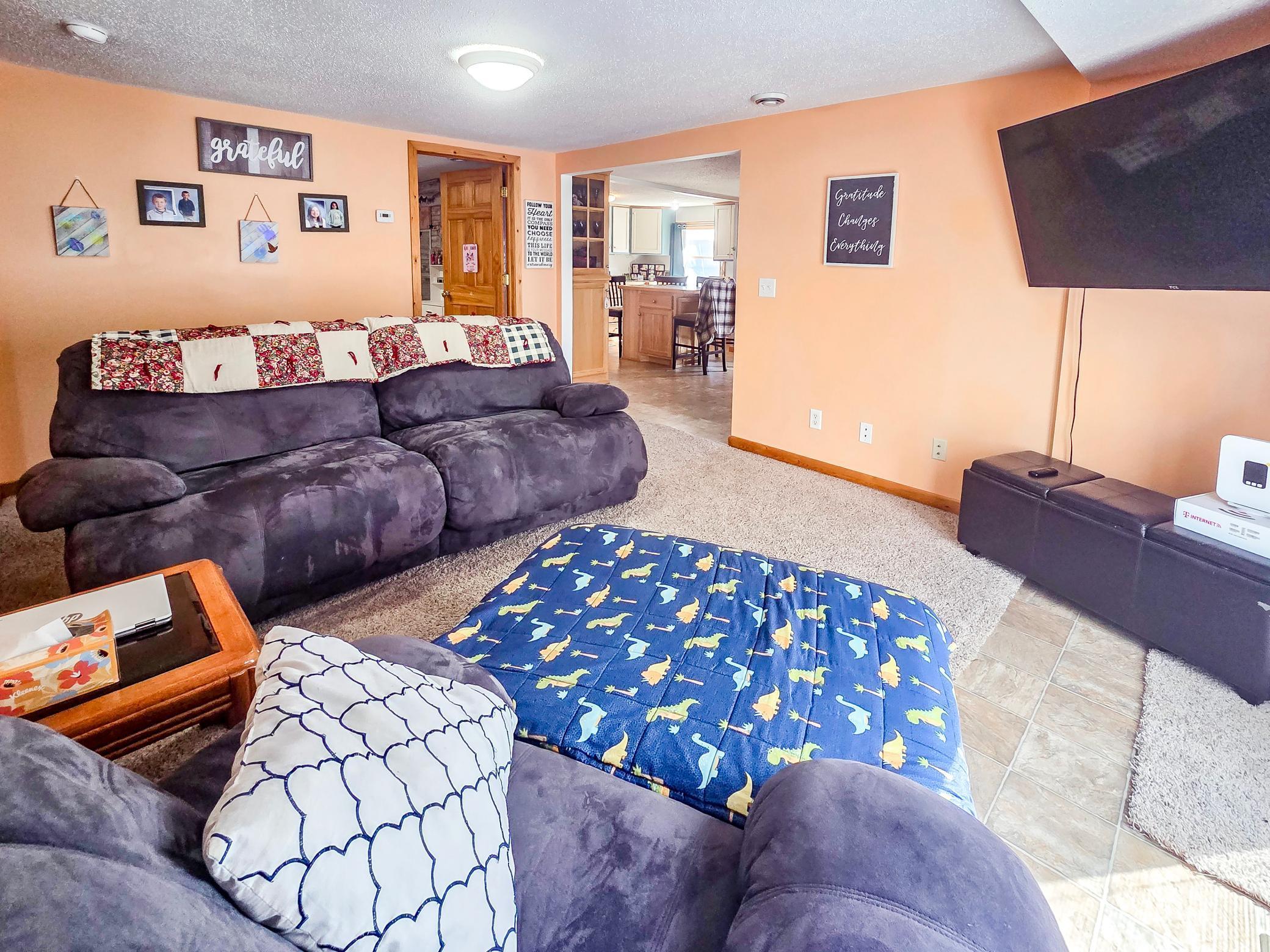 Living room facing kitchen and bedroom 3