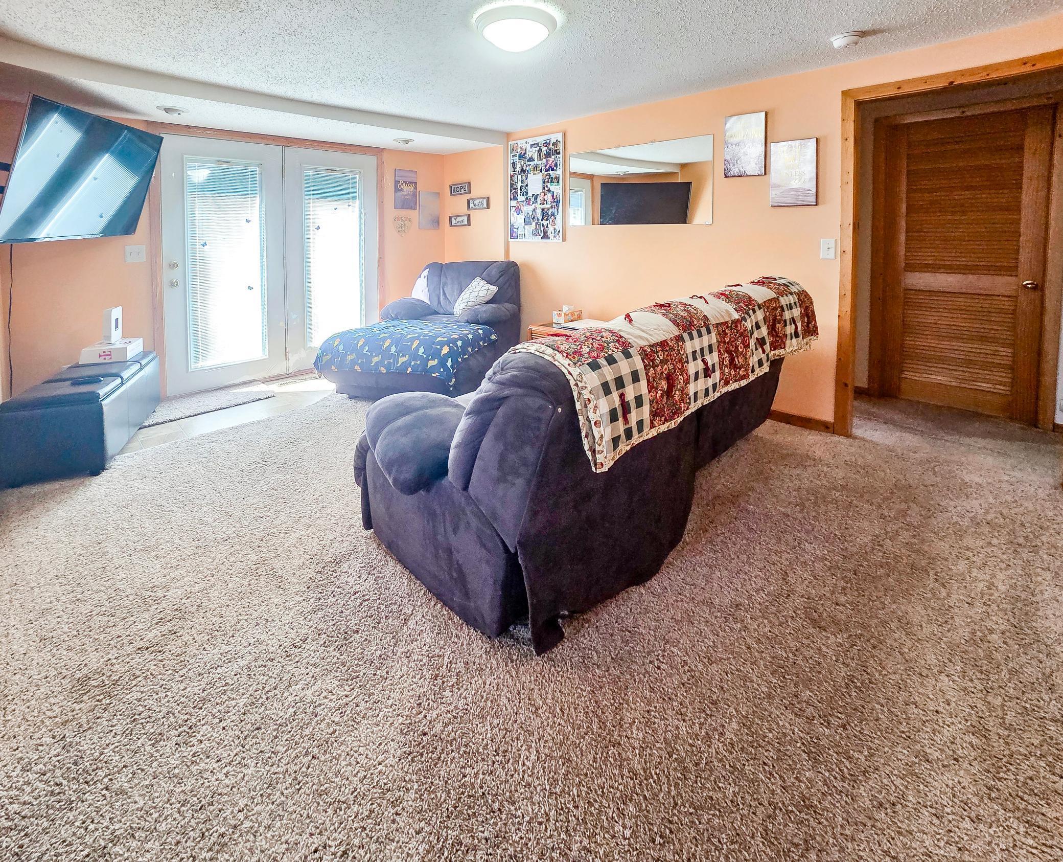Living room with doors to deck