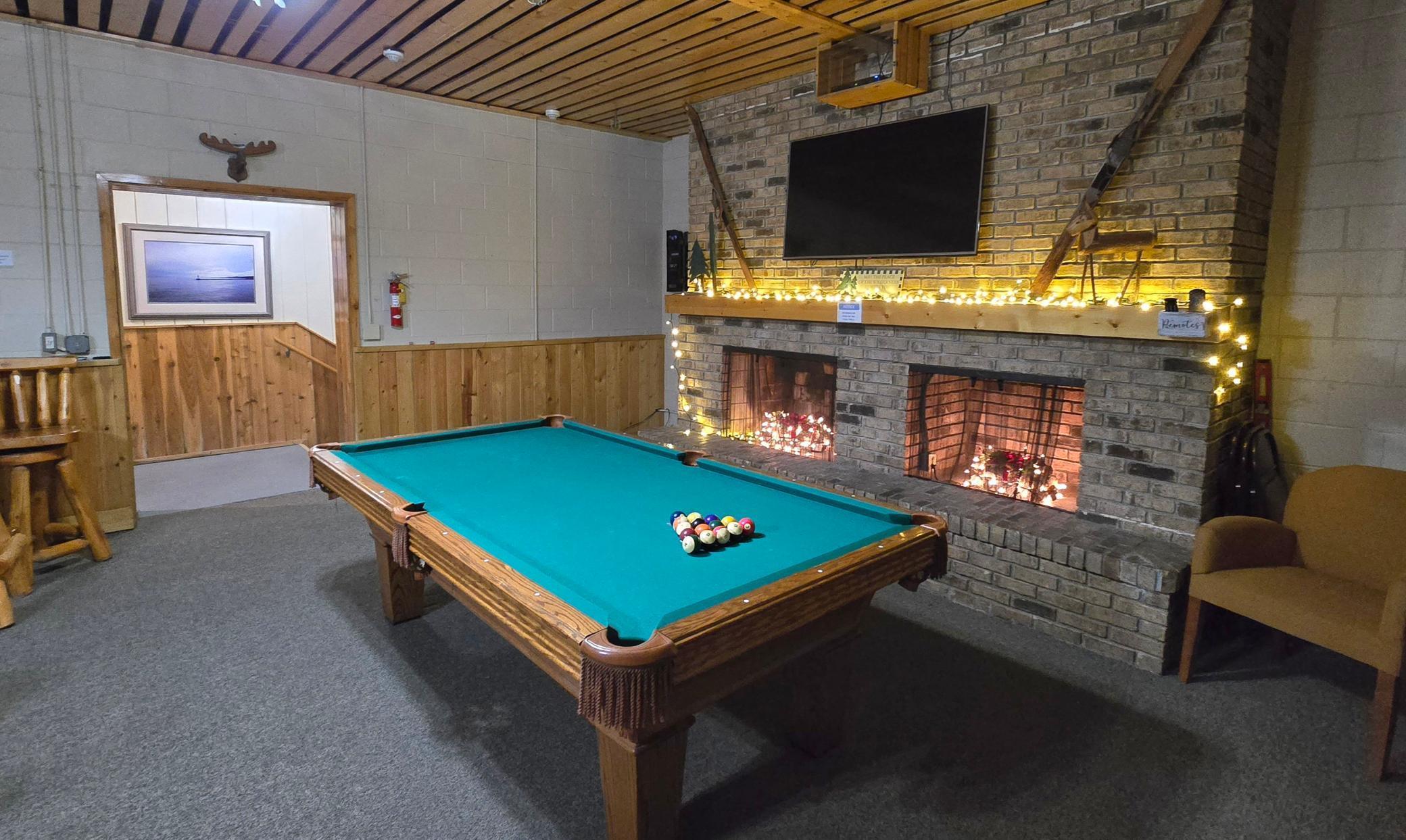 Game room with billiards table, ping pong, darts and foosball