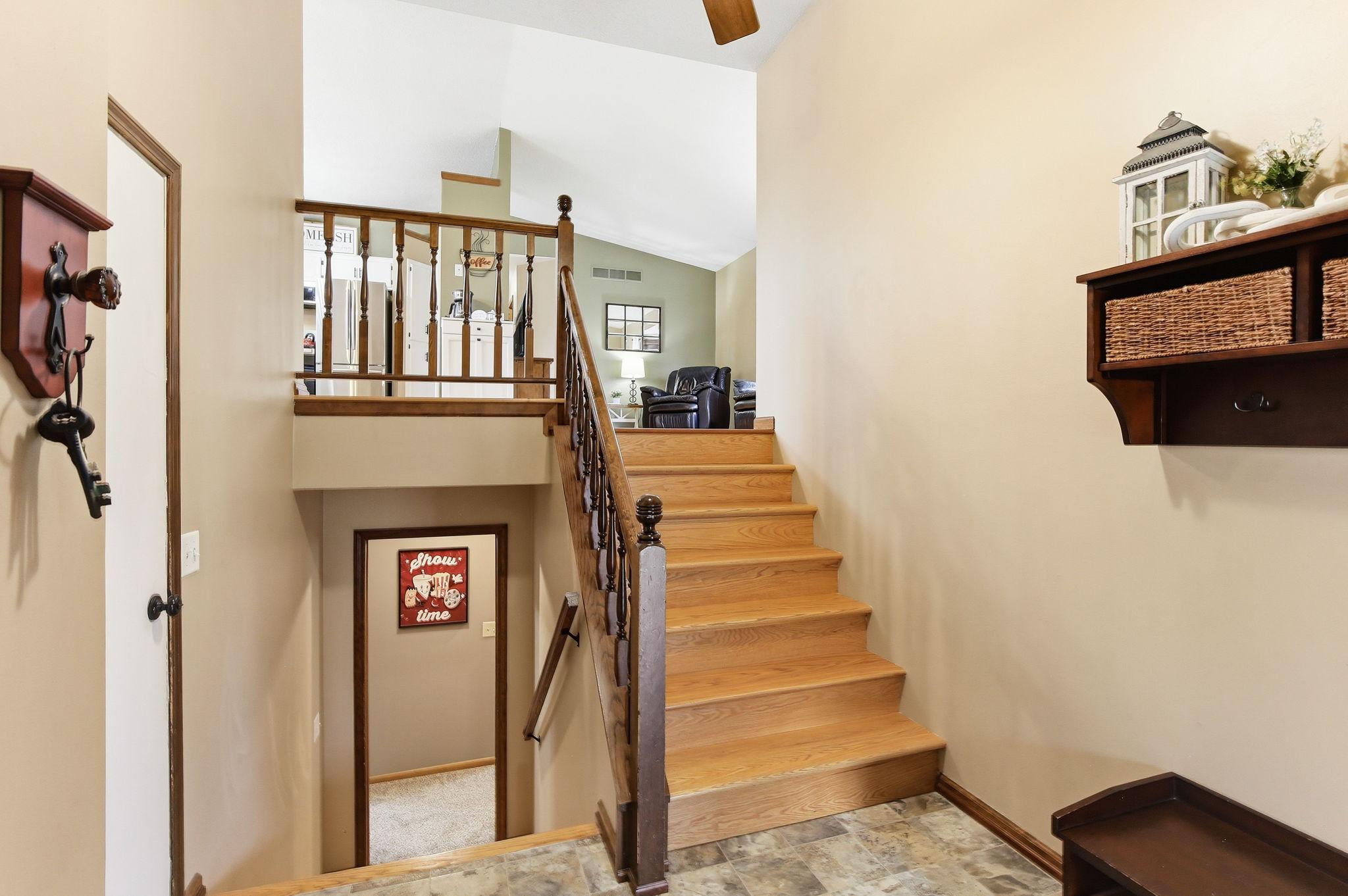 Spacious foyer with garage access and an entryway closet, offering a practical and welcoming space for storage and everyday convenience.