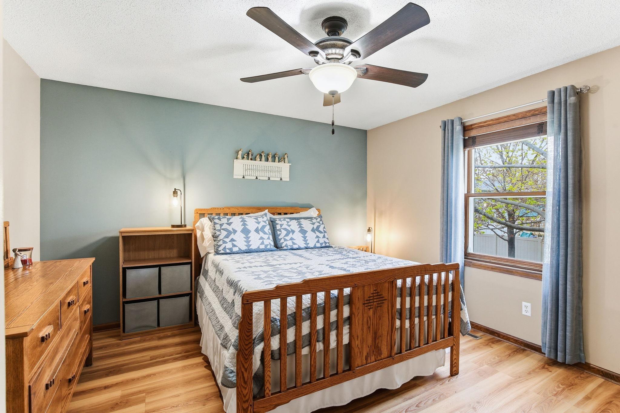Main-floor primary bedroom offering convenient single-level living, with a comfortable layout and easy access to the main living areas for added privacy and everyday ease.