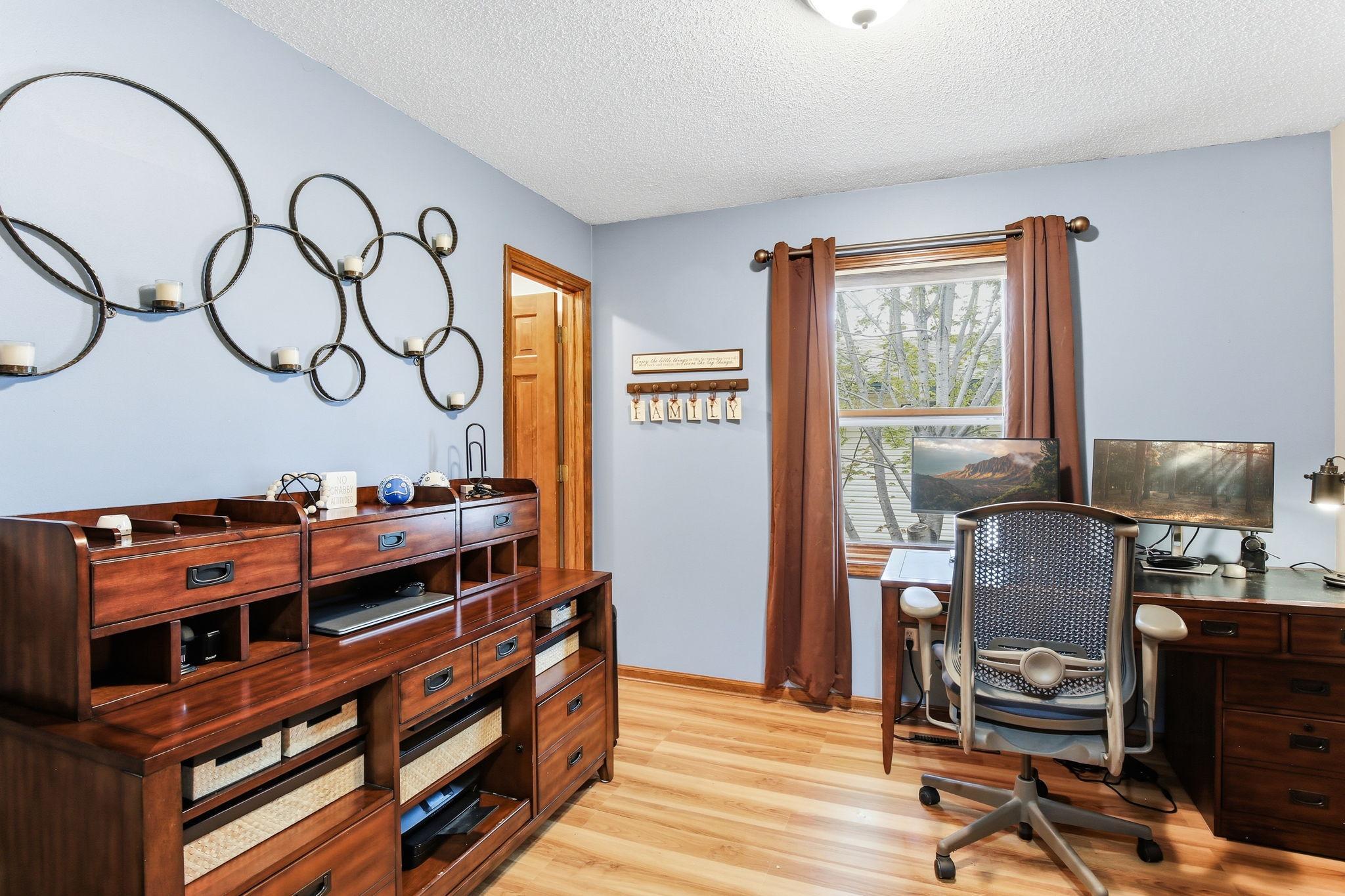 Second main-level bedroom featuring a comfortable layout and an amazing closet with excellent storage, offering both functionality and convenience on the main living floor.