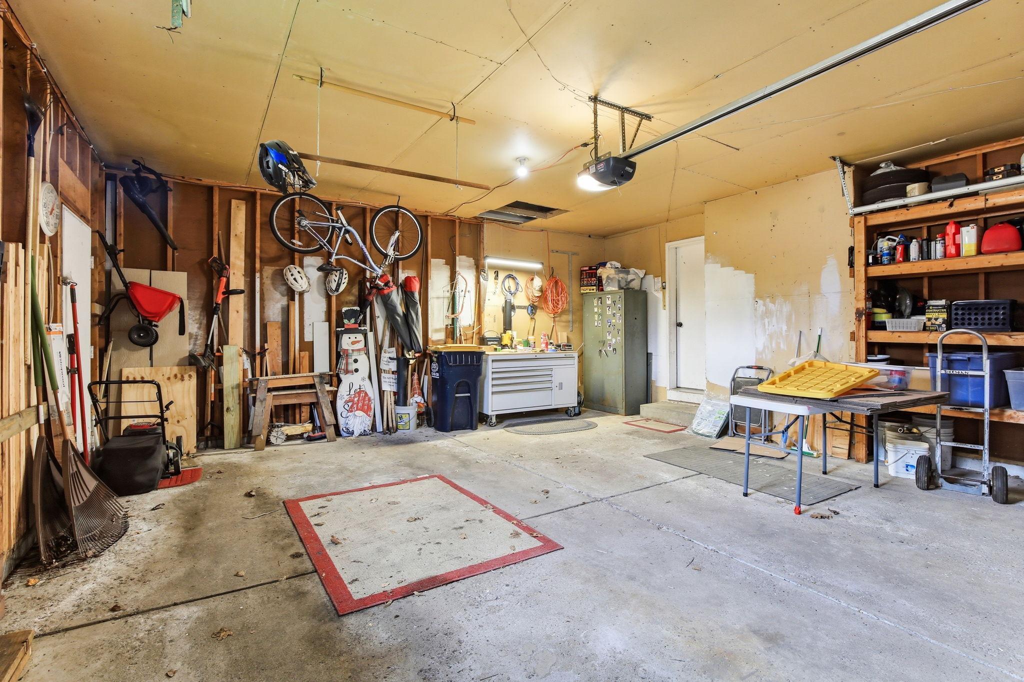 Two-car garage offering ample parking and NEW garage door opener (2026)