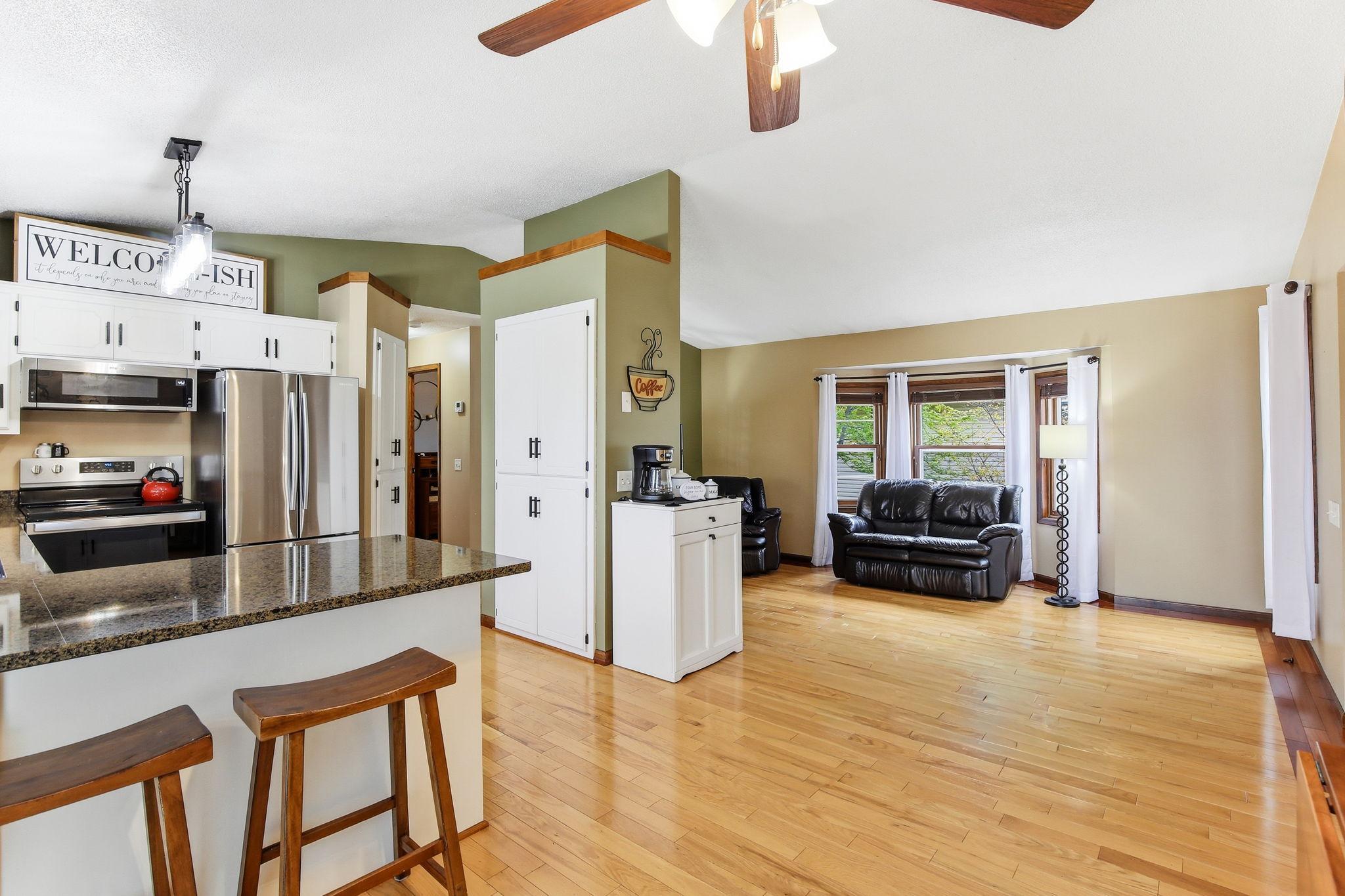 Open floor plan with a seamless flow between living, dining, and kitchen areas, creating a spacious and connected layout.