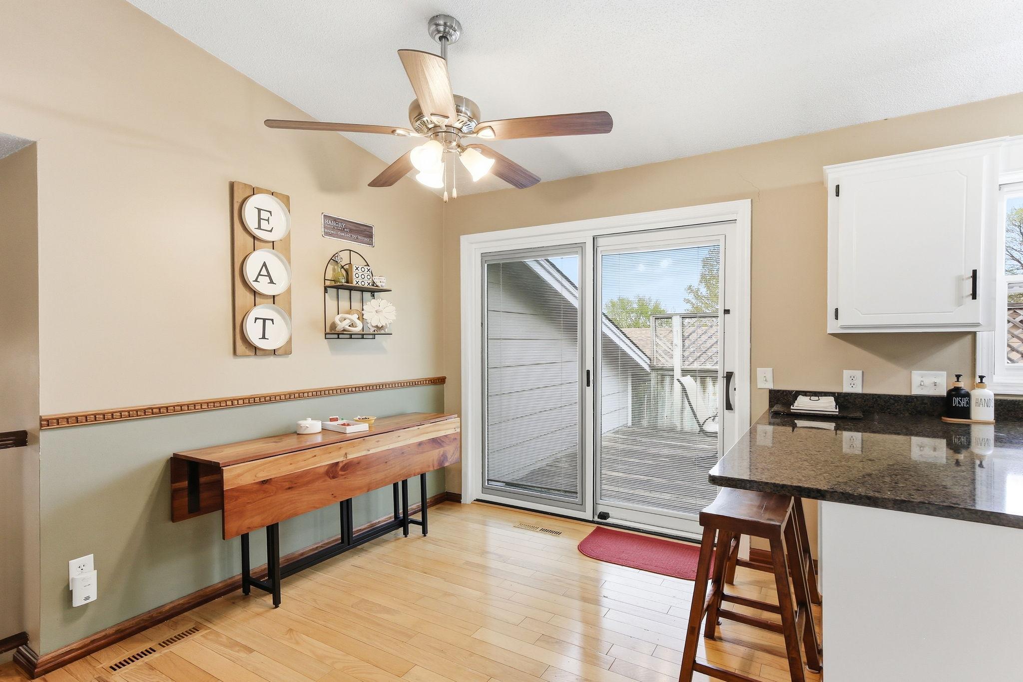 Sliding doors provide easy access to the deck, filling the space with natural light and creating a smooth indoor-outdoor flow.
