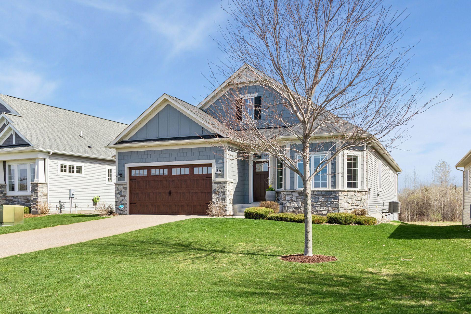 Large front yard and extra long concrete driveway - feels more like a single family home.