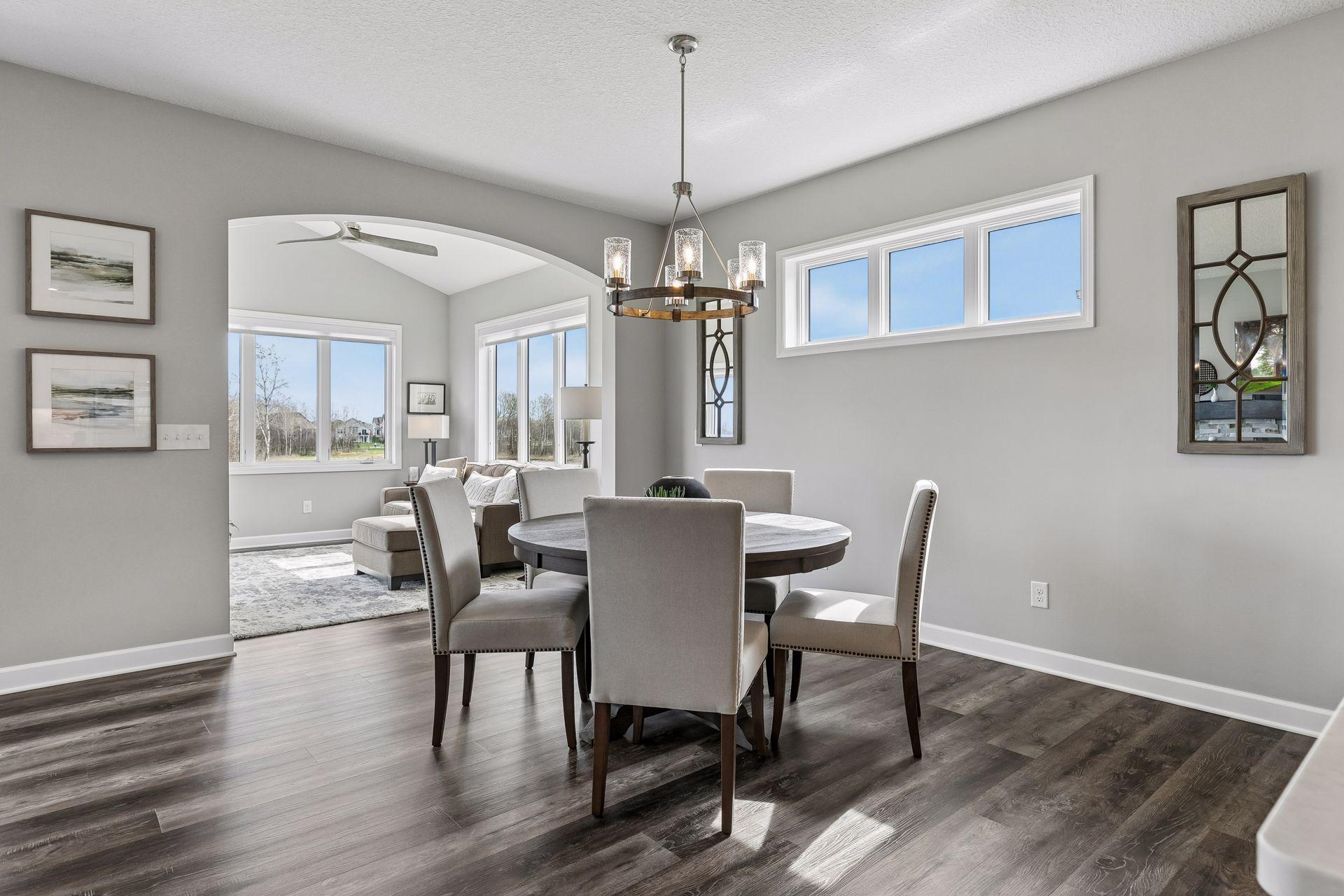 Generous dining area can accommodate a table of any size, in addition space for extension for hosting large groups. Notice the arch detail going in to the Sun Room.