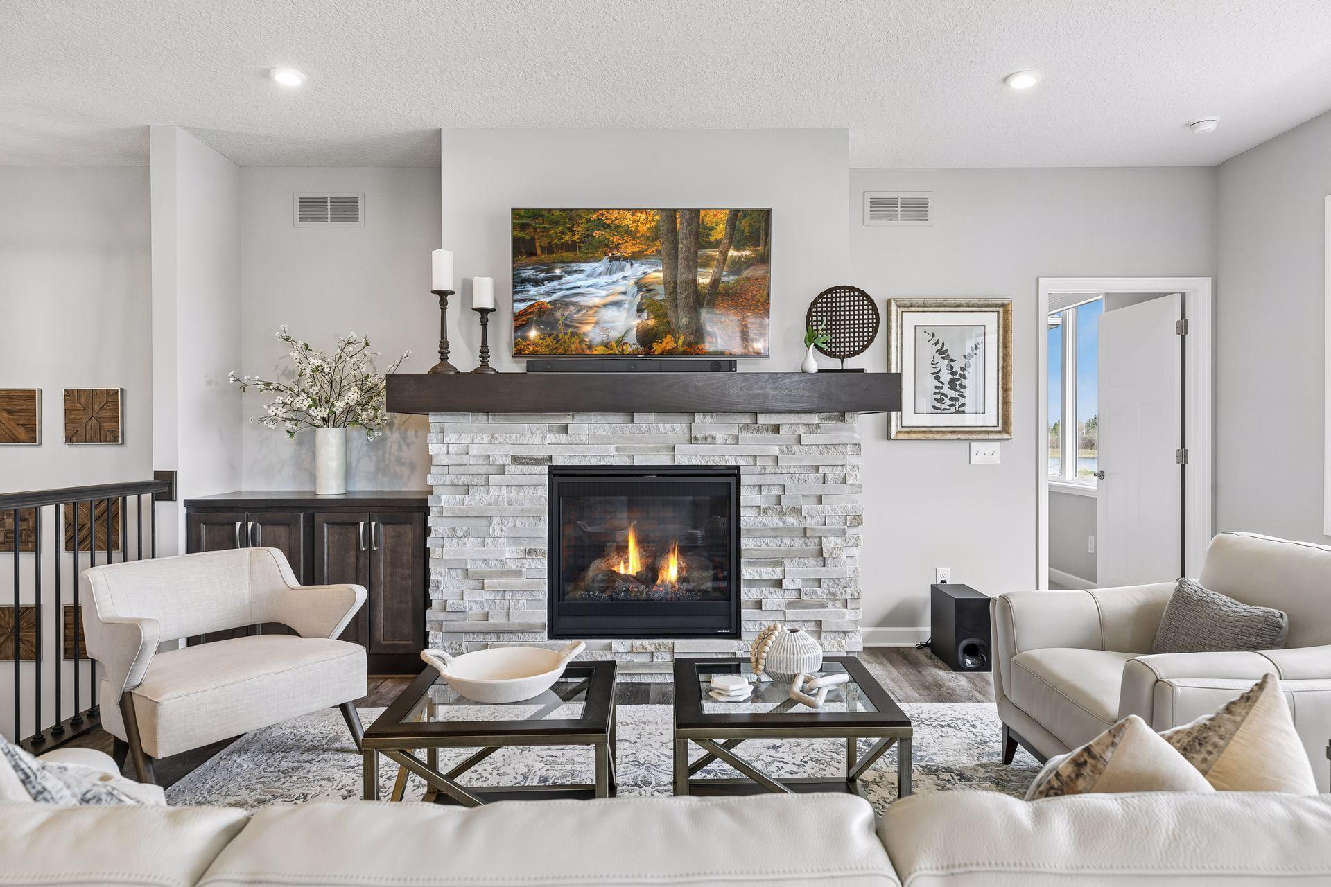 Built-in cabinet, custom mantle and ledge stone fireplace.