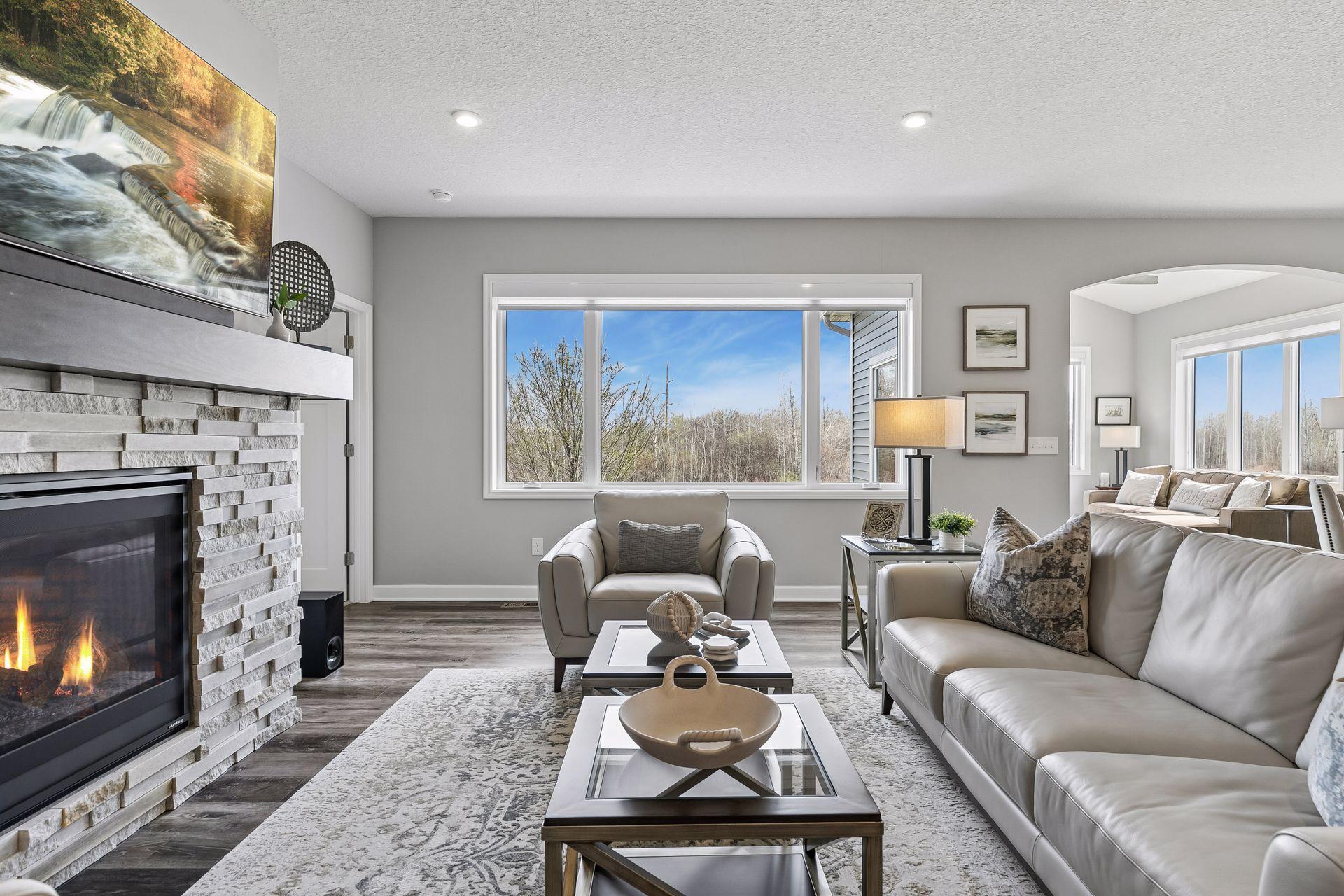 The large windows out the back take full advantage of the beautiful backyard backdrop.