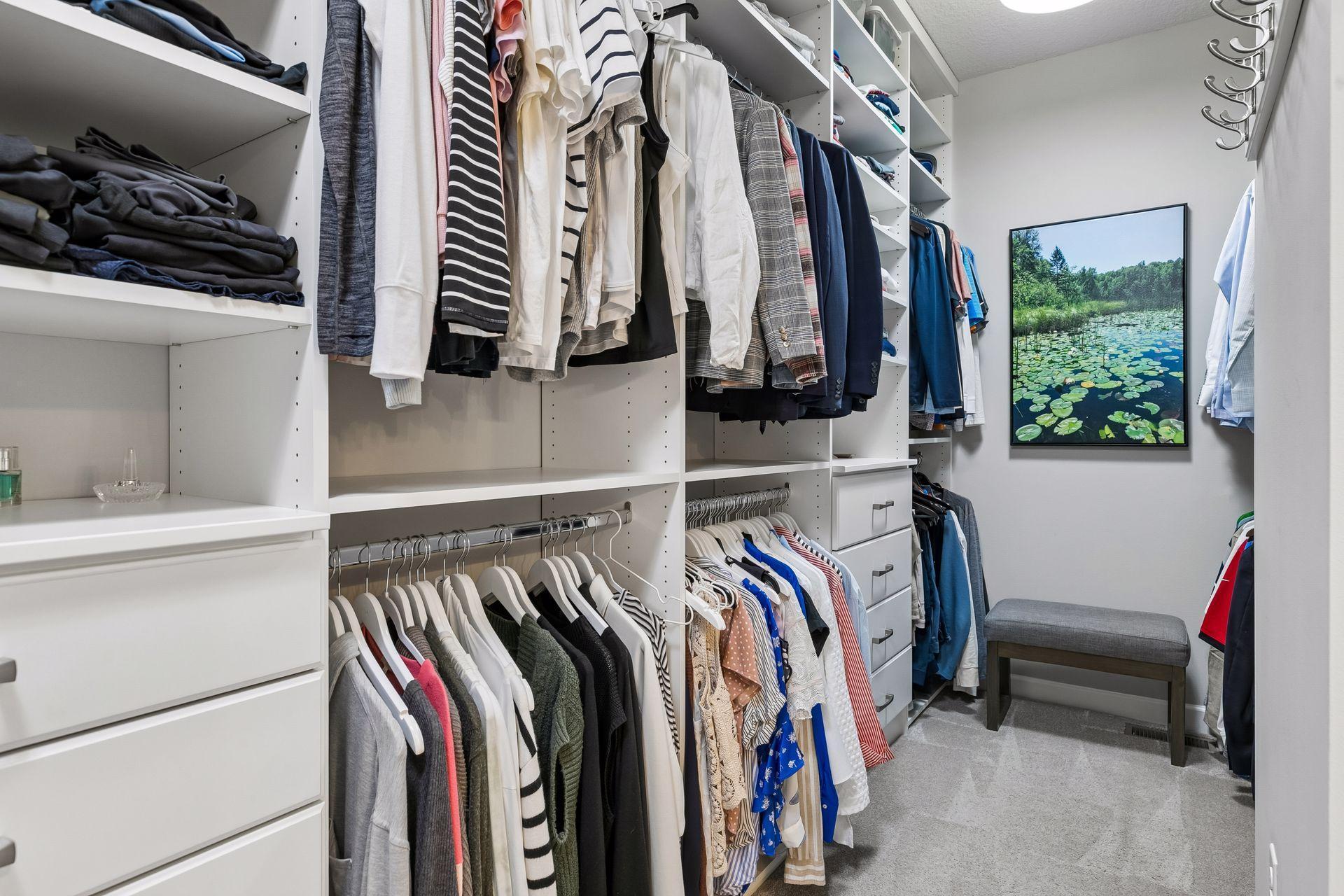 Primary closet has been custom equipped to maximize storage and organization. Built-in dressers, shoe/handbag storage, in addition to all the double hanging rods.