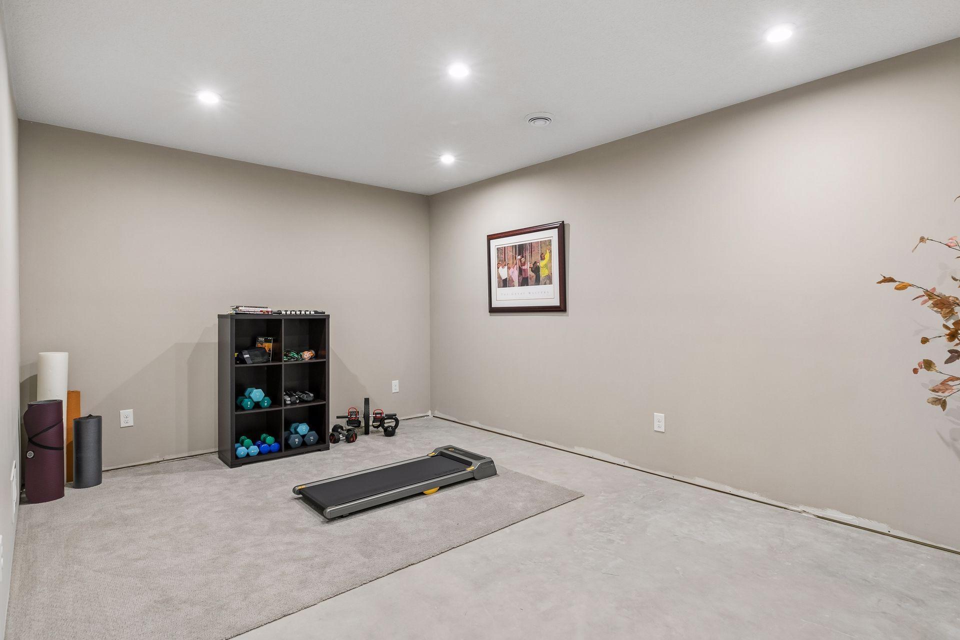 Exercise/Hobby room has finished ceiling and finished walls. This room is counted as part of homes total finished sqft.