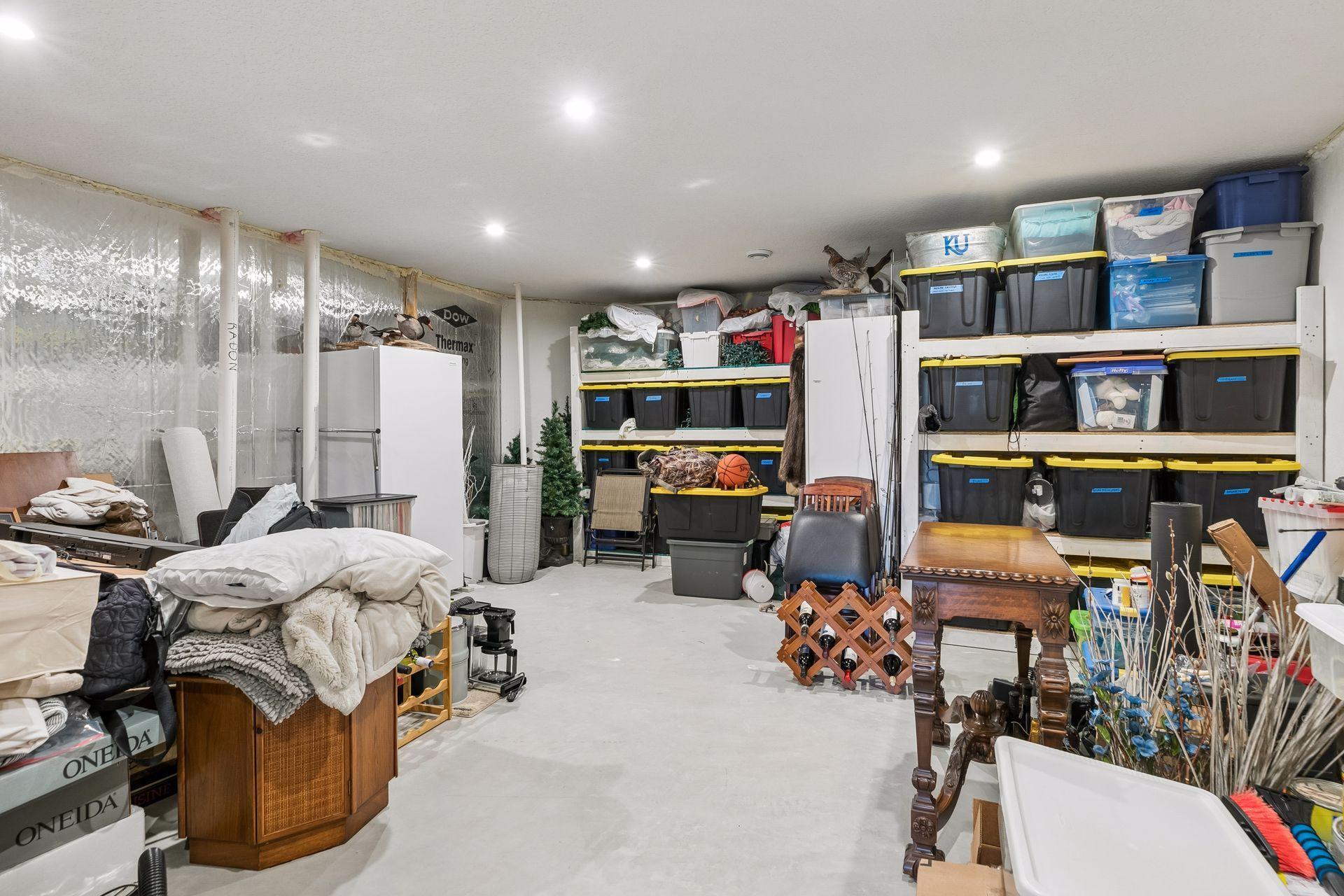 Storage space: Built-in storage racks, finished ceiling & recessed lights makes this a good use of space. Mechanical information: 2 zone heating and cooling, and April-Air Humidifier. Sump pump w/battery backup for peace of mind.