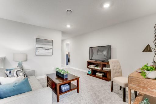 A fantastic secondary living area; great for a movie night with the family! *Photo is of a model home.