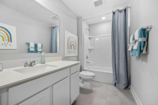 Large bathroom in the upper hall. *Photo is of a model home.