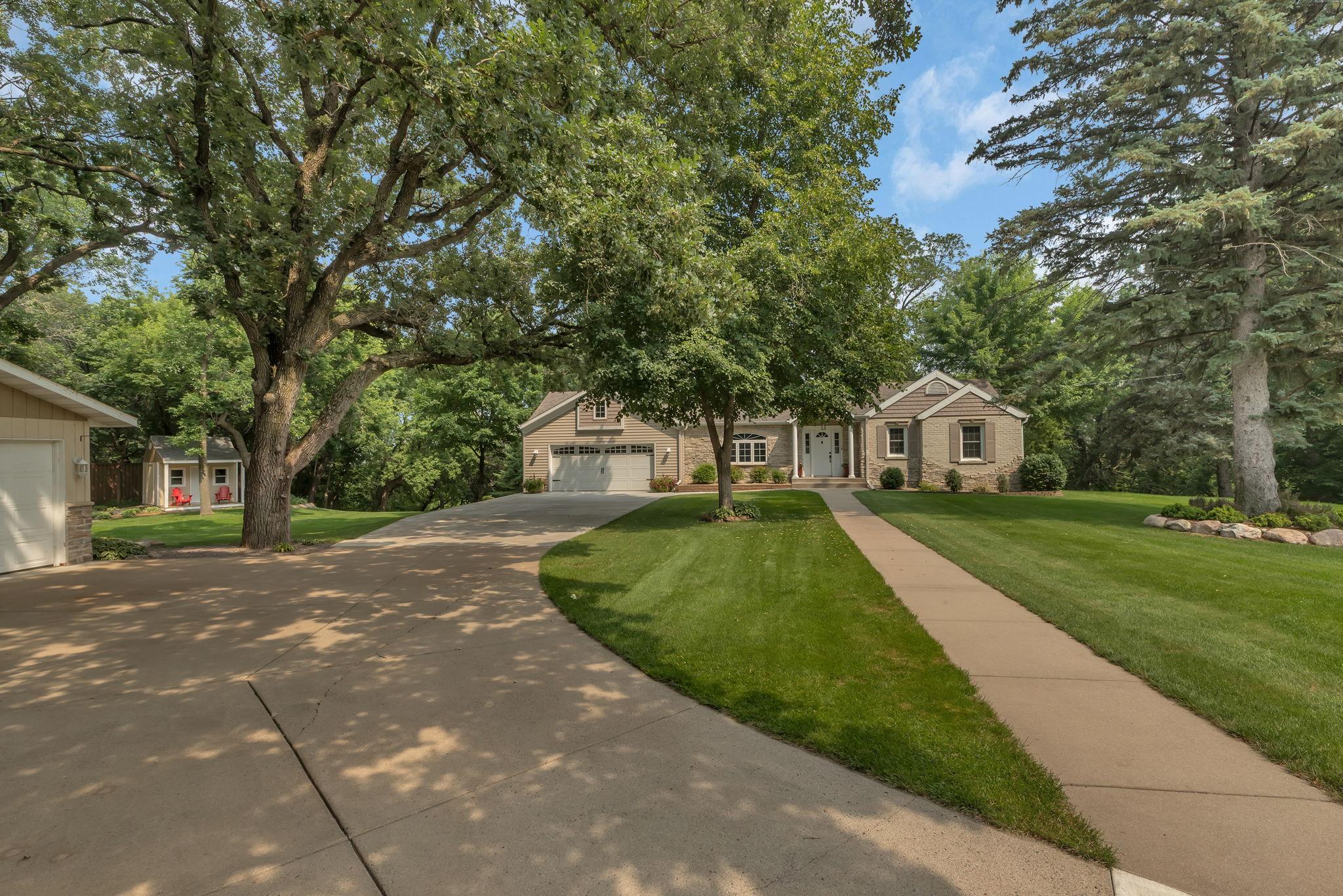 This 4BR/3BA One Level Home Is Nestled Amongst The Mature Trees!