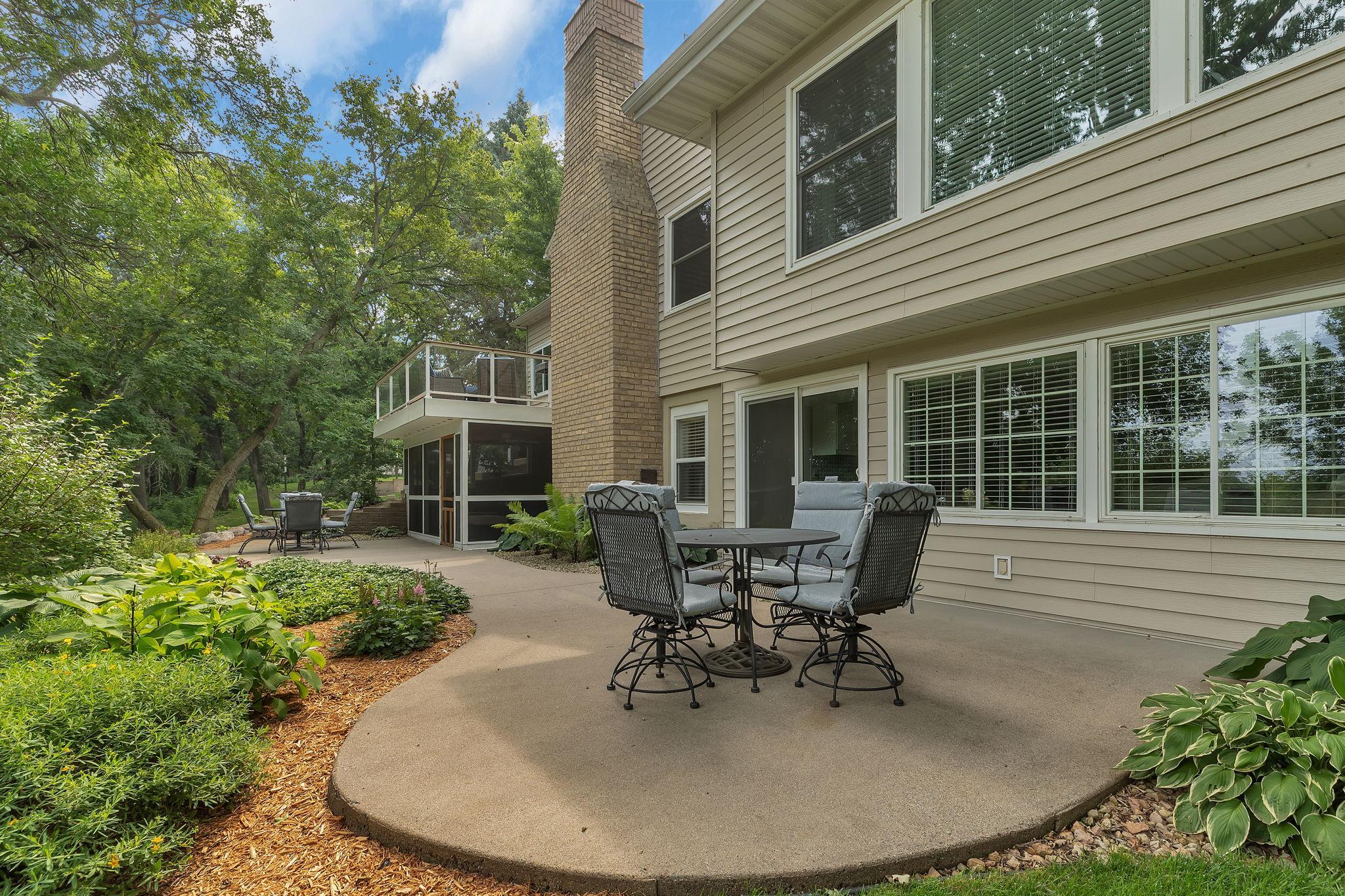 Patios And Raised Deck Offers A Private Setting Overlooking Mature Trees. This Backyard Sanctuary Features River Views And Trails!!