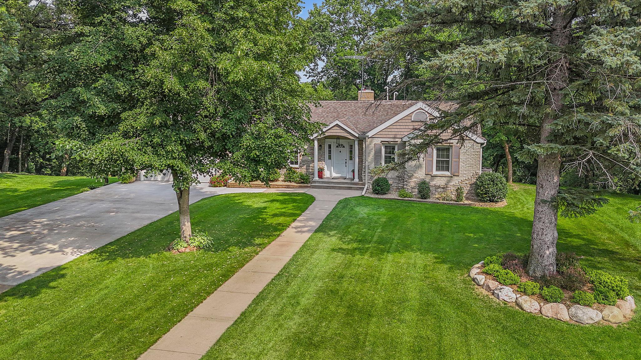 WALK-OUT RAMBLER, ADDITIONAL DETACHED GARAGE, HEAVILY WOODED ALMOST 1 ACRE LOT AND UPDATED THROUGHOUT!!! Pride Of Ownership Inside And Out!