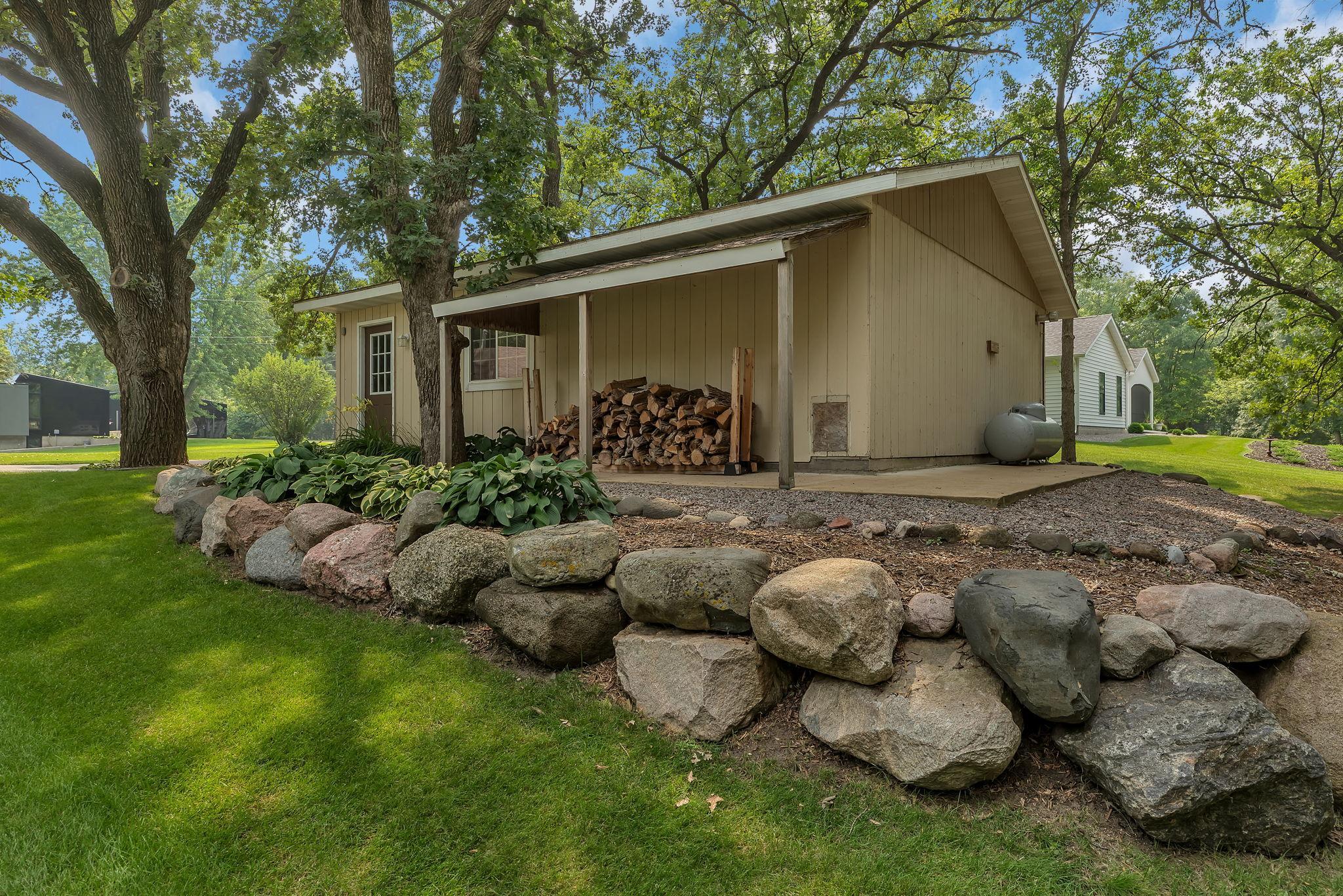Heated Additional Shed! Enjoy The Sitting Under The Porch Enjoying Views Of The Side And Back Yard!!!