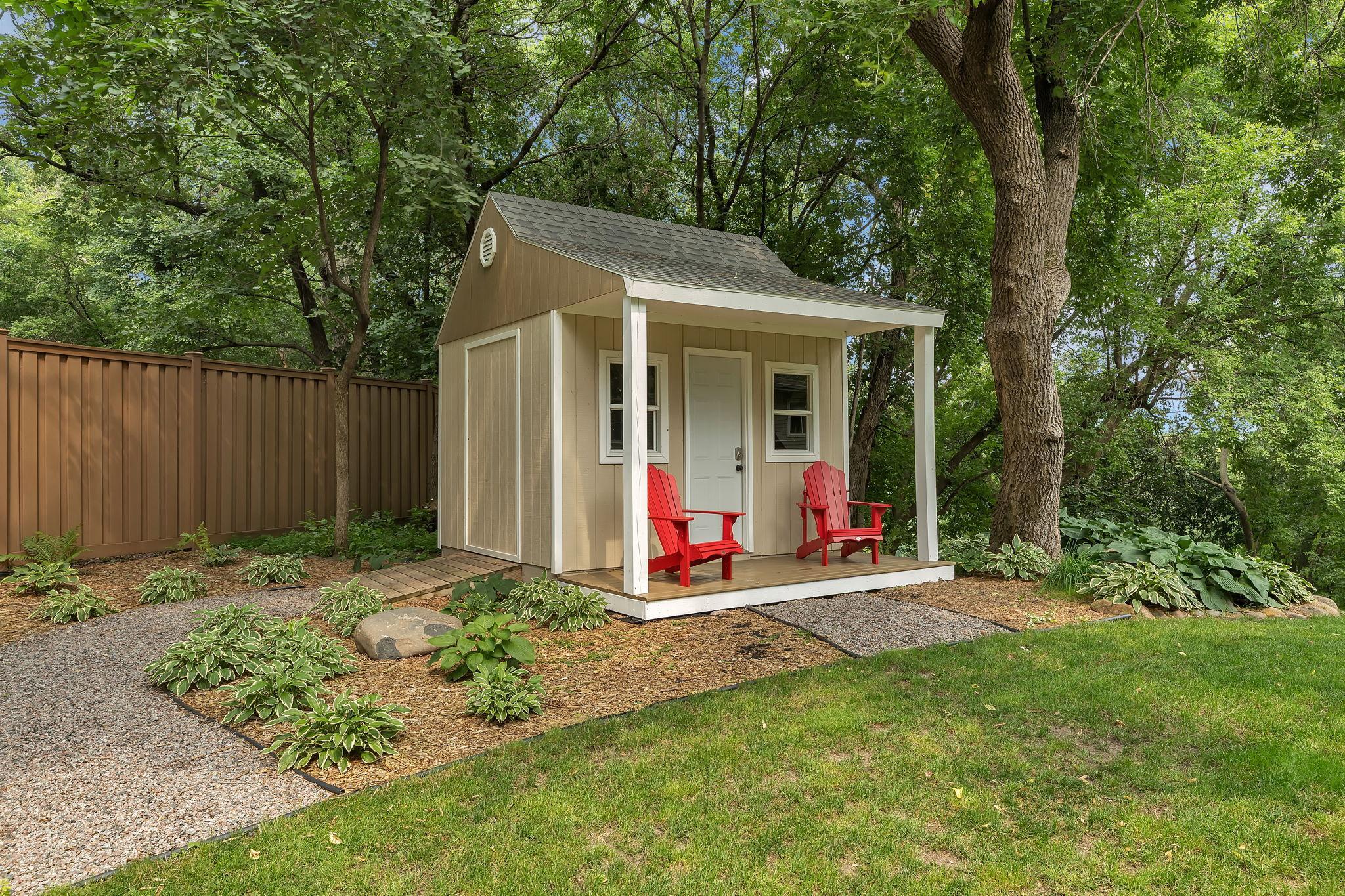 Charming garden shed provides excellent storage with potential for a custom playhouse or "she shed." Enjoy quiet moments and dreams on the lovely attached porch