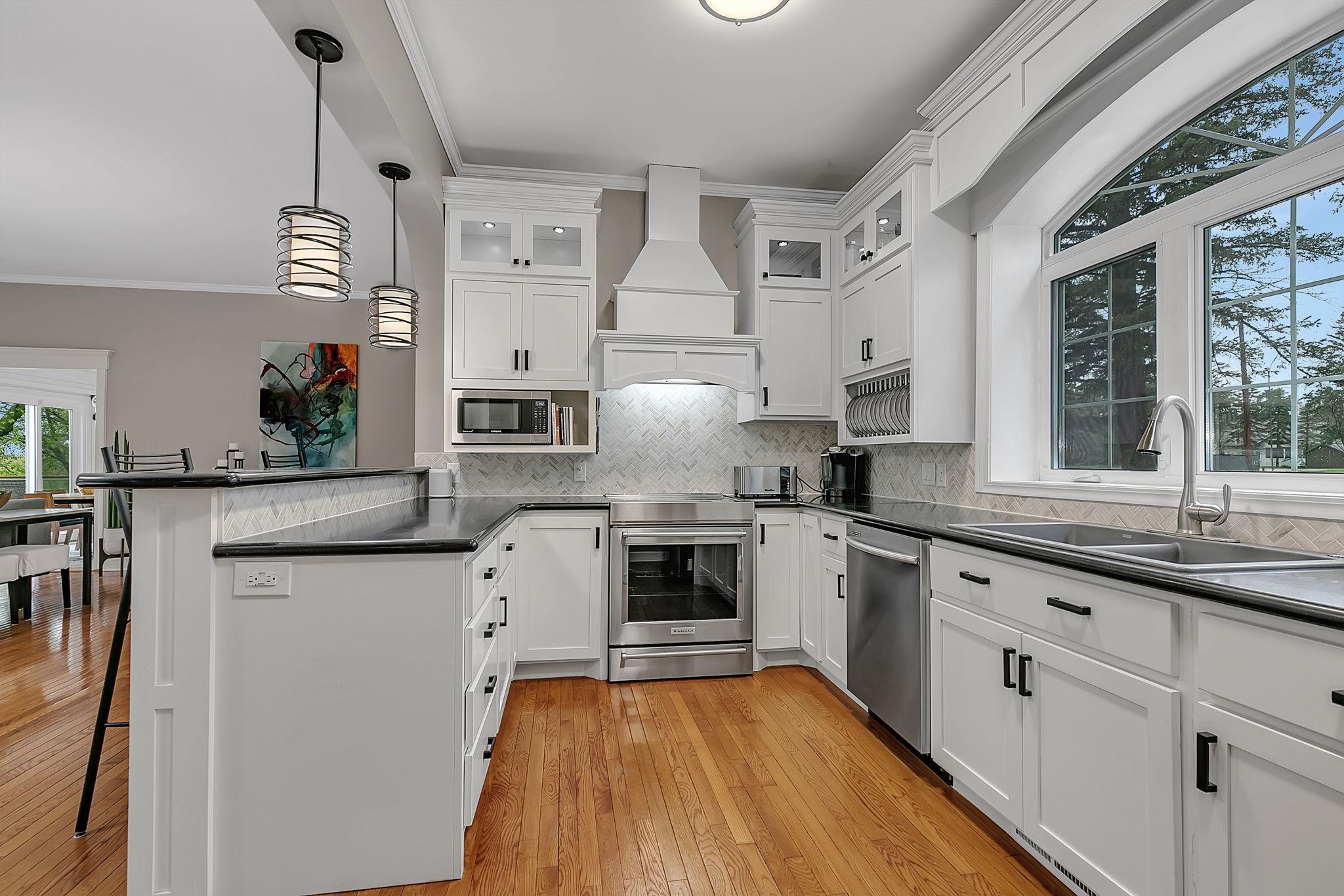 Freshly Designed Kitchen With Quarts (Silestone) Counter Tops, Sleek Stainless Steel Appliances, Including A Brand-New Induction Range, Seamlessly Overlooks The Combined Dining And Living Space.