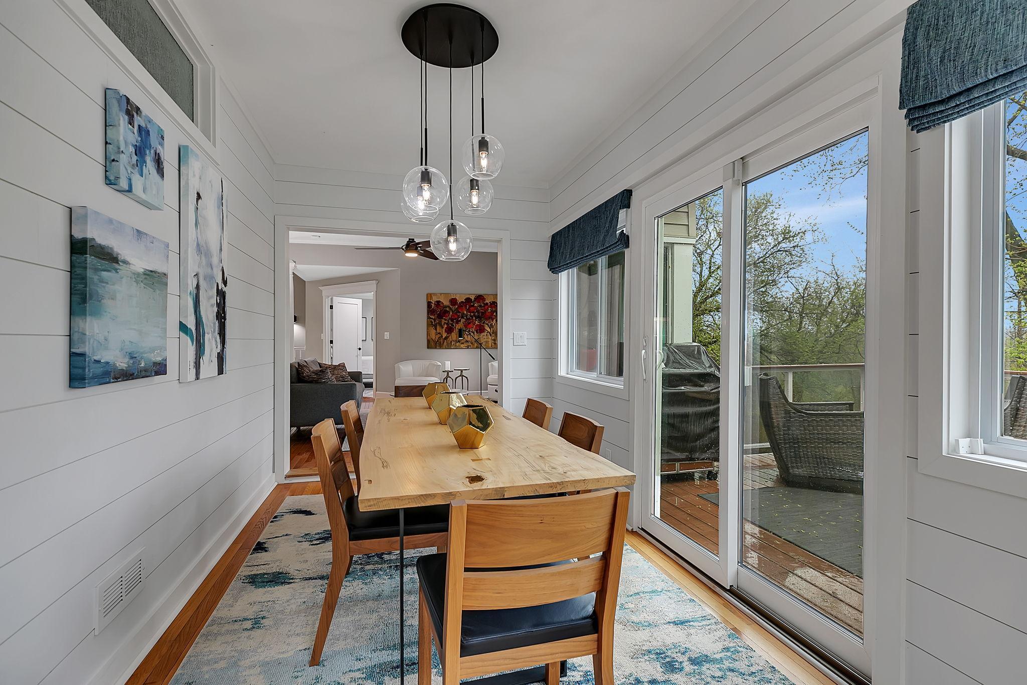 Overlooking The Open Main Floor, The Sun Room Steps Out To A Beautiful, Maintenance-Free Deck With Endless Backyard Views!