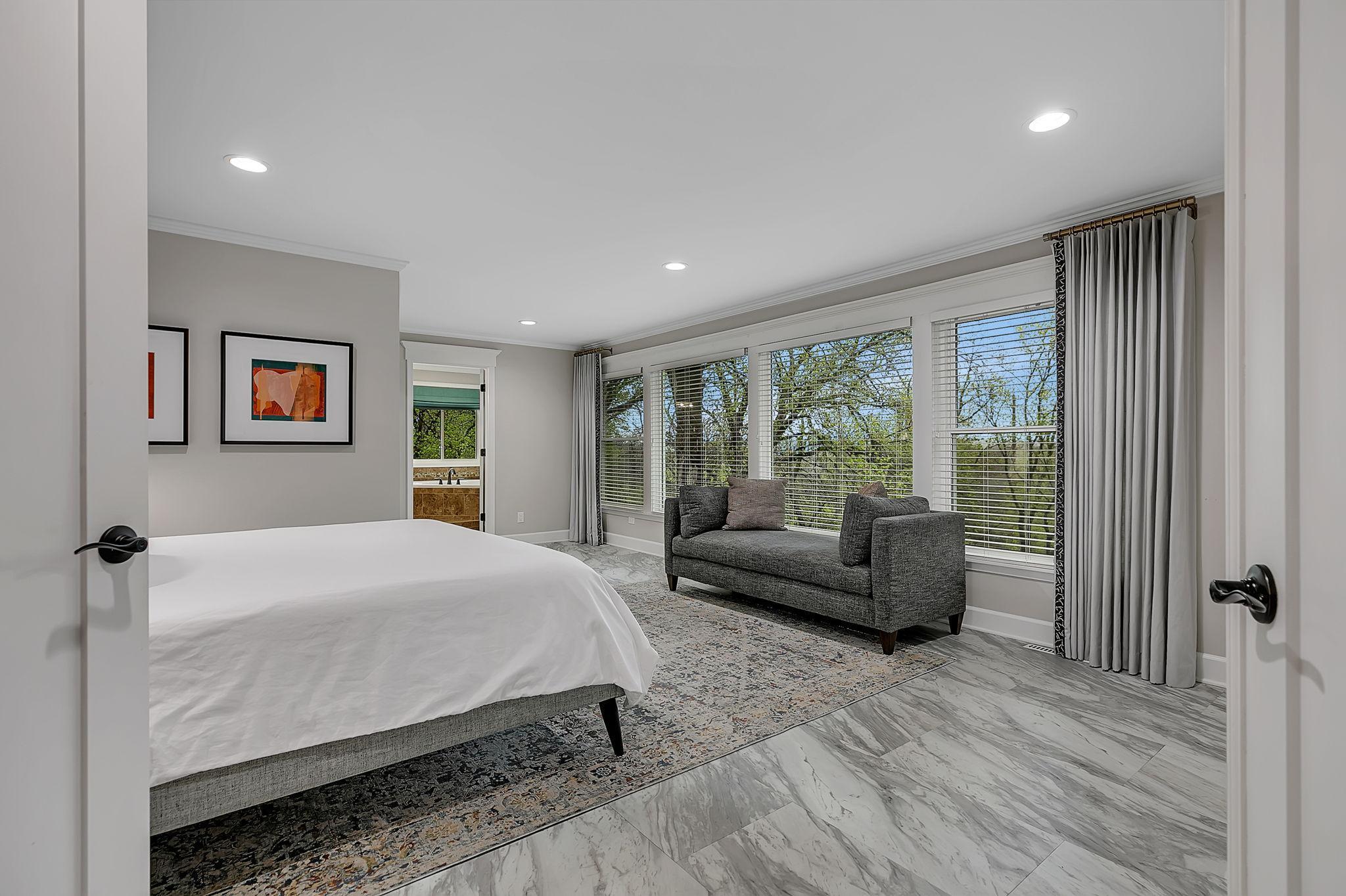 Newly Updated Expansive Primary Owner's Suite Is Designed For Relaxation, Boasting A Private Bath And Wweeping Views Through Large Picture Windows That Are Truly Unforgettable!