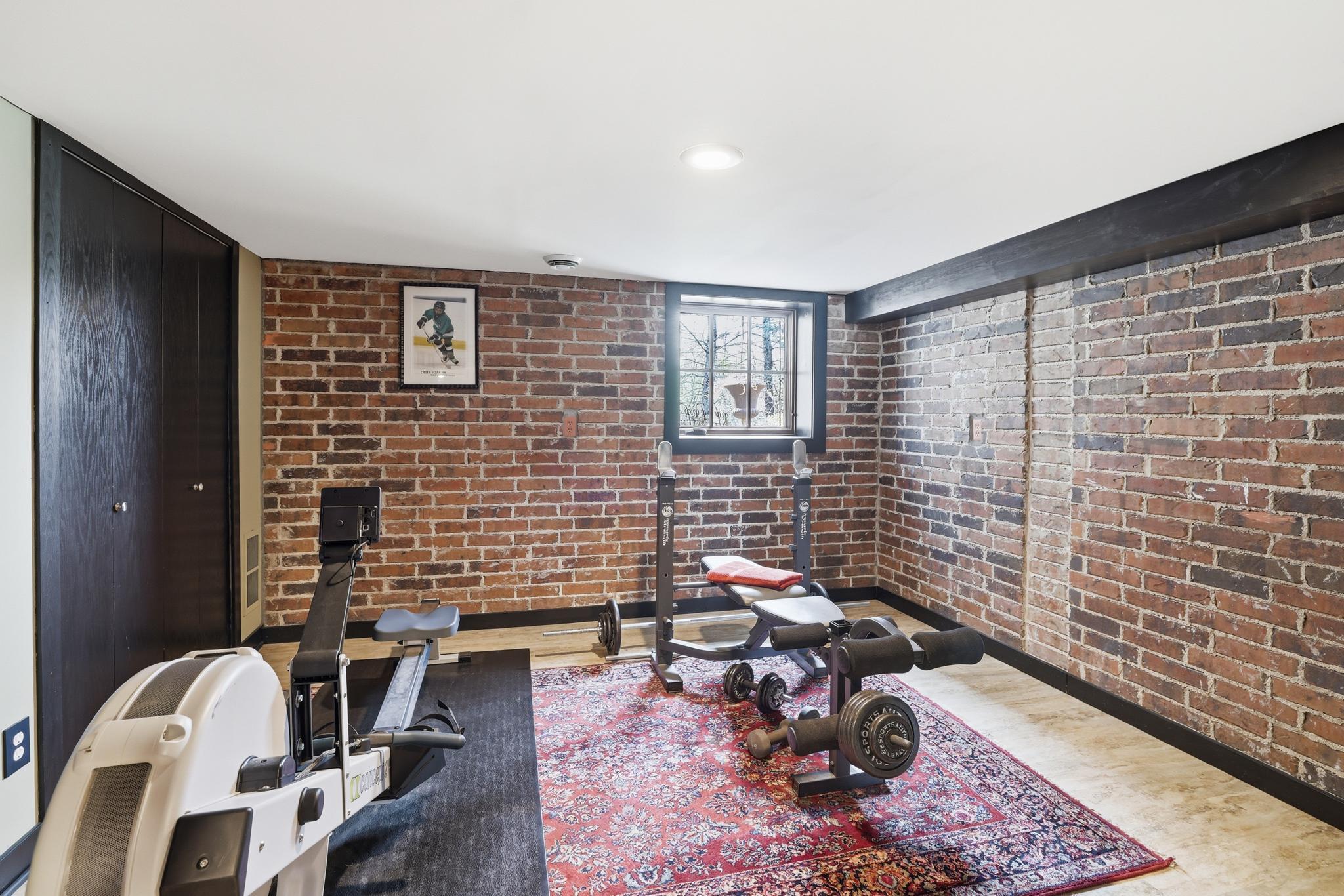 Lower level bedroom used as workout room