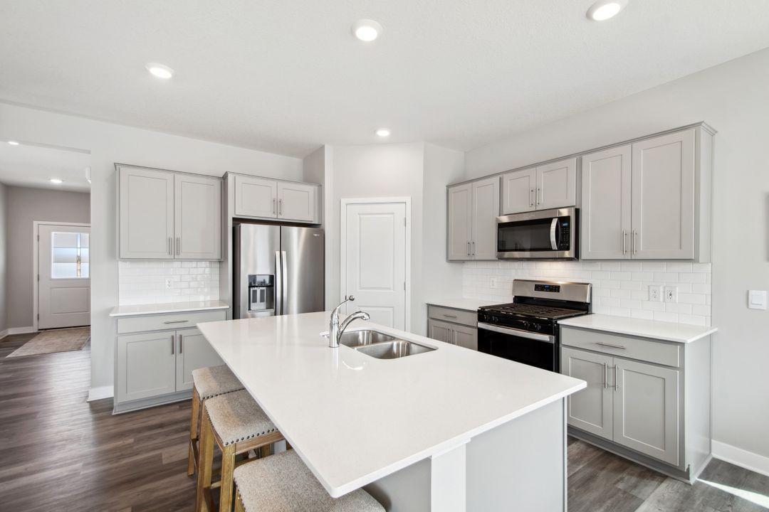 This kitchen is a chef's delight! Quartz countertops, stainless steel appliances, vented hood!