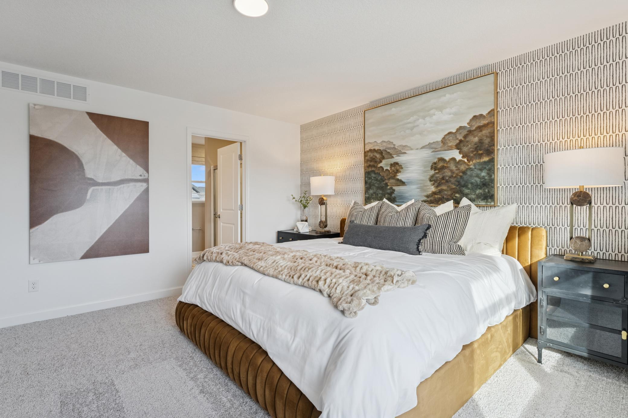 (*Photo of actual model) The spacious primary suite is the perfect space to relax and unwind at the end of the day