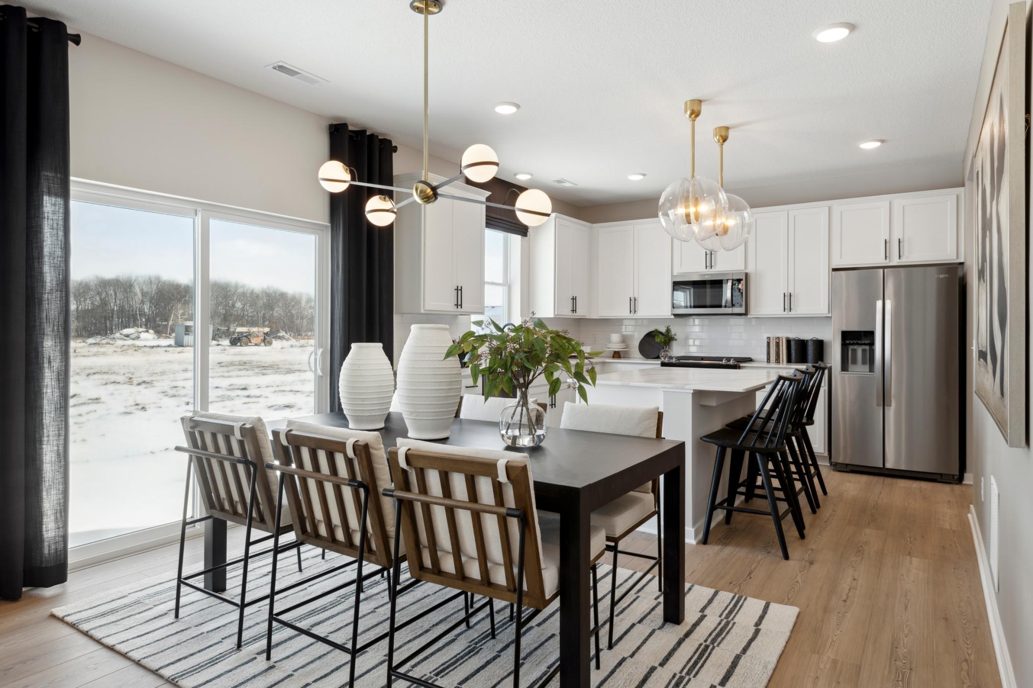 The dining area’s location within the open floorplan provides easy access to the kitchen, living area, and outdoor spaces, perfect for indoor-outdoor living..jpg