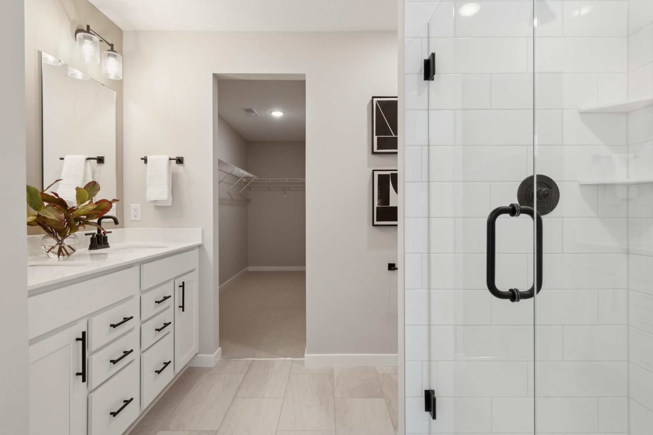 Generous vanity with ample counter space and under-sink storage provides both practicality and style, ideal for everyday routines..jpg