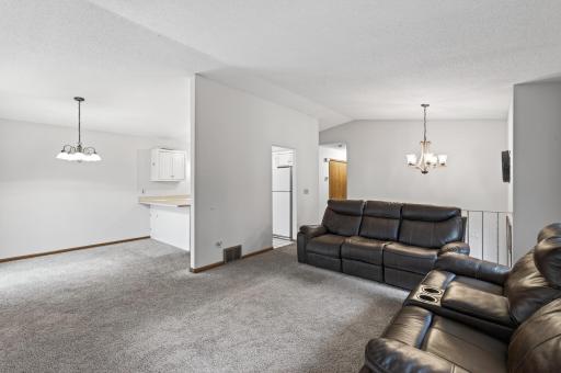 Living Room is adjacent to both the Dining Room and Kitchen on the Upper Level
