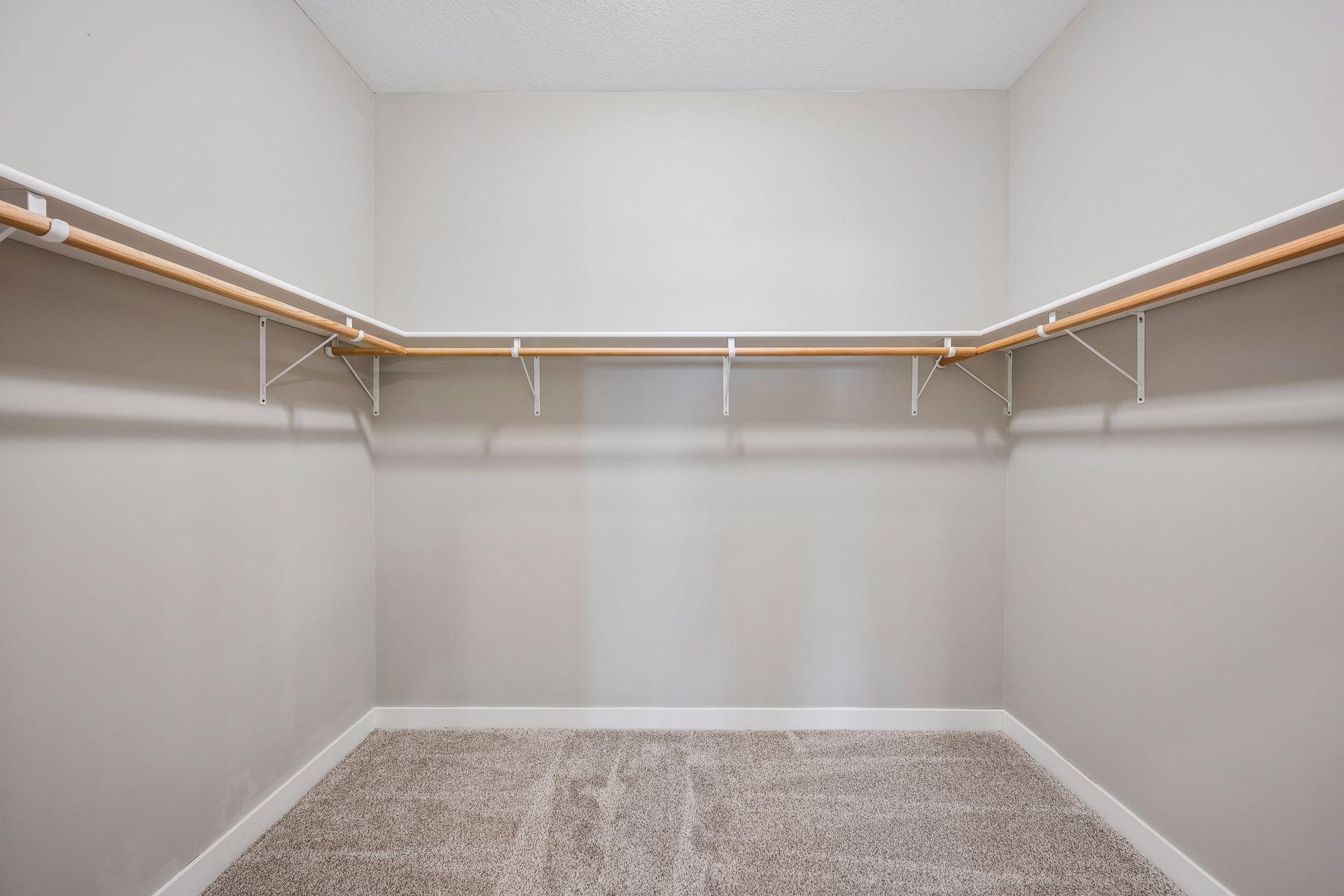Huge primary walk-in closet.
