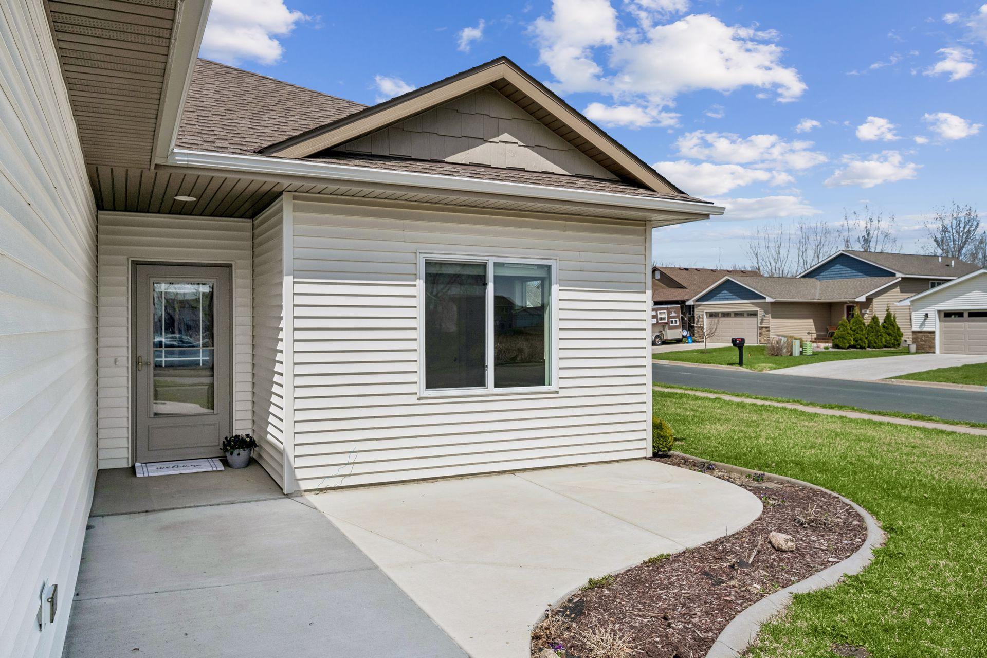 Welcoming front entry, with a nice concrete front patio.