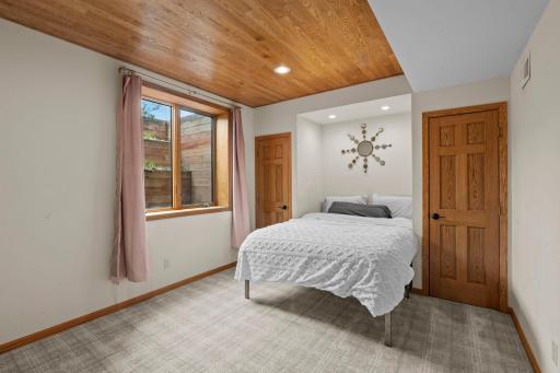 Additional bedroom with dual closets provides exceptional flexibility for living or guests.