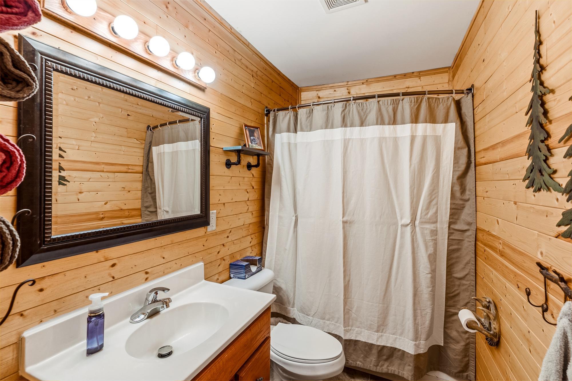 The full bathroom is equipped with both a tub and shower.