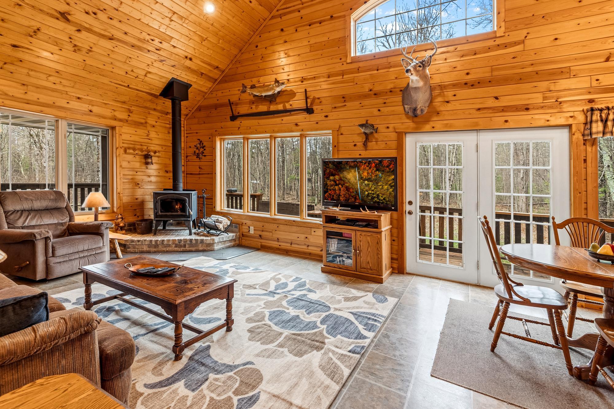 Beautiful knotty pine, vaulted ceiling, wood stove and large windows facing south.