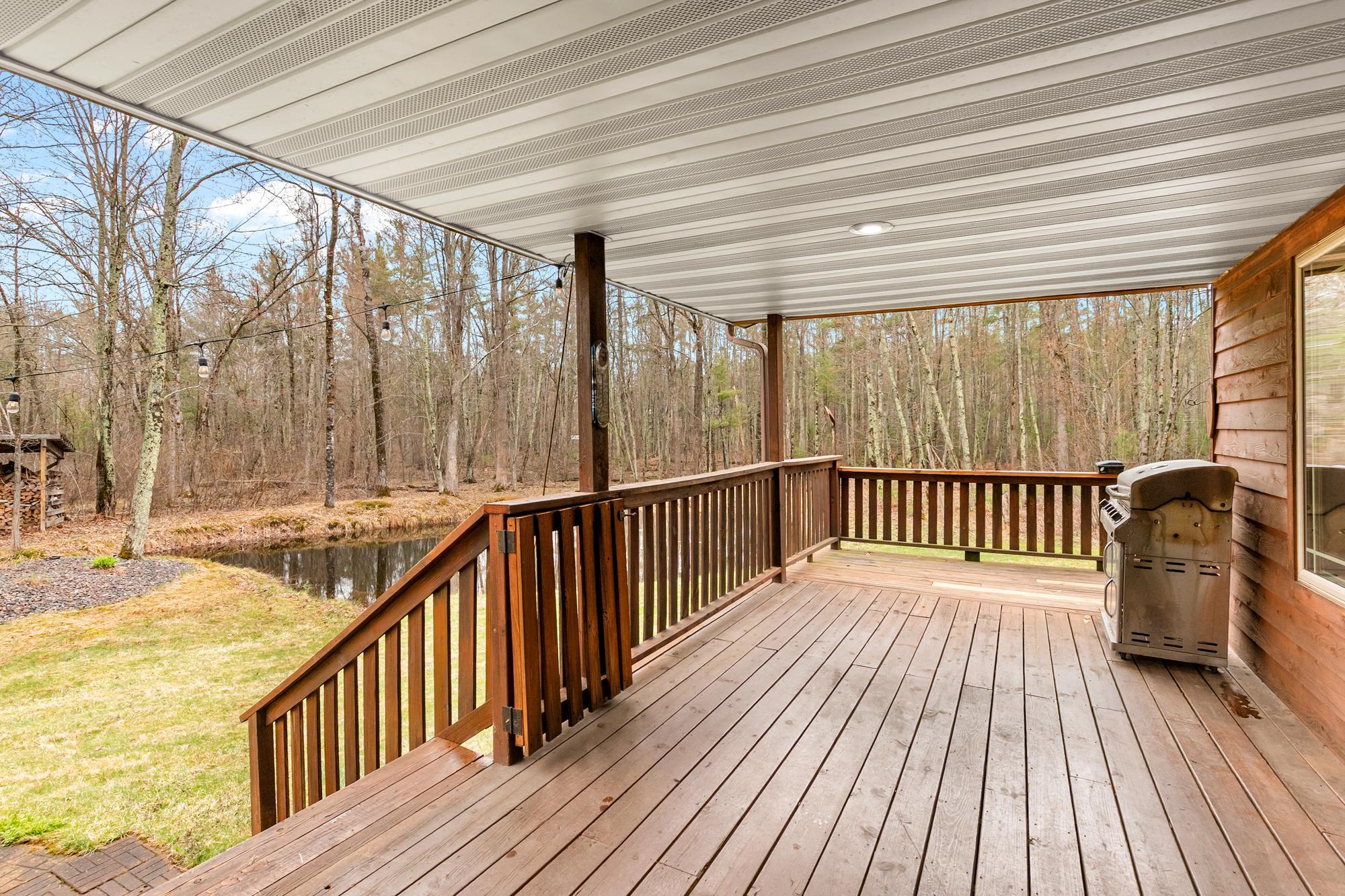 Spacious front deck/porch with a gate at the top of the stairs to help contain small children and pets.