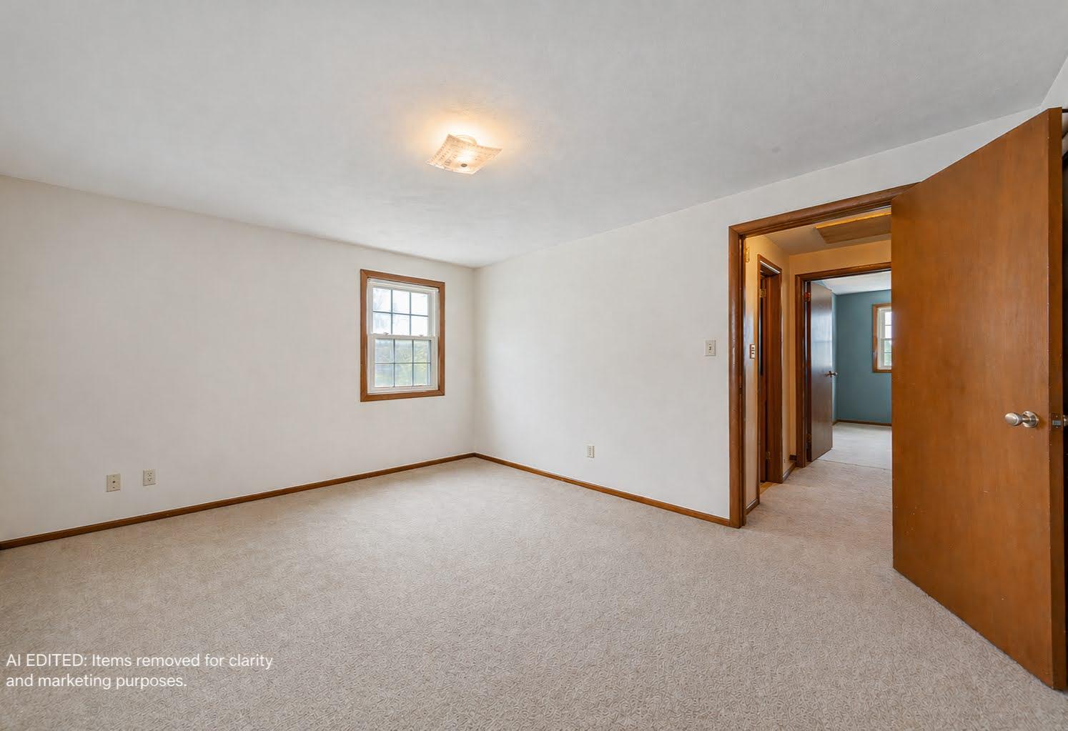Bedroom 1 - This photo has been AI edited to remove personal property and clutter for marketing purposes. Actual property condition may vary.