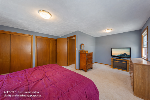 Primary Bedroom - This photo has been AI edited to remove personal property and clutter for marketing purposes. Actual property condition may vary.
