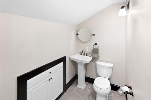 Dedicated private bath area with toilet and sinkâideal for added convenience and shared use.