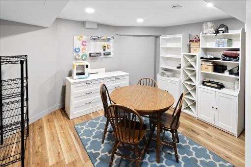 Additional finished lower-level flex space, ideal for office, playroom, or hobby area.